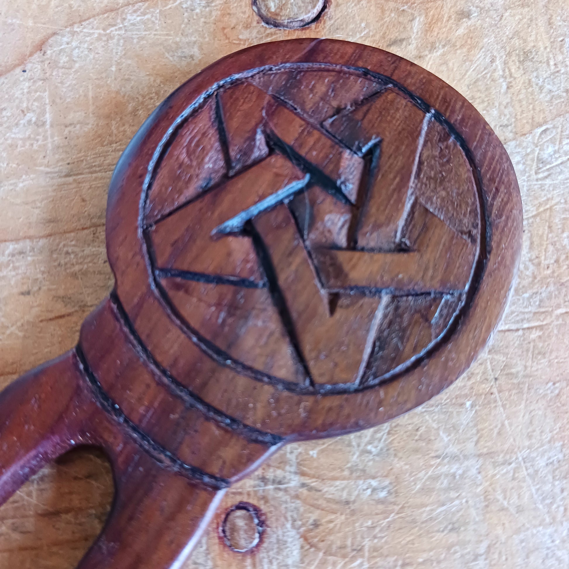 Slip into a realm of whispered enchantments with the Pentacle Design Hair Fork. Handcrafted from rich, dark natural wood, its elegant two-pronged form tucks smoothly into your hair, offering both beauty and balance.