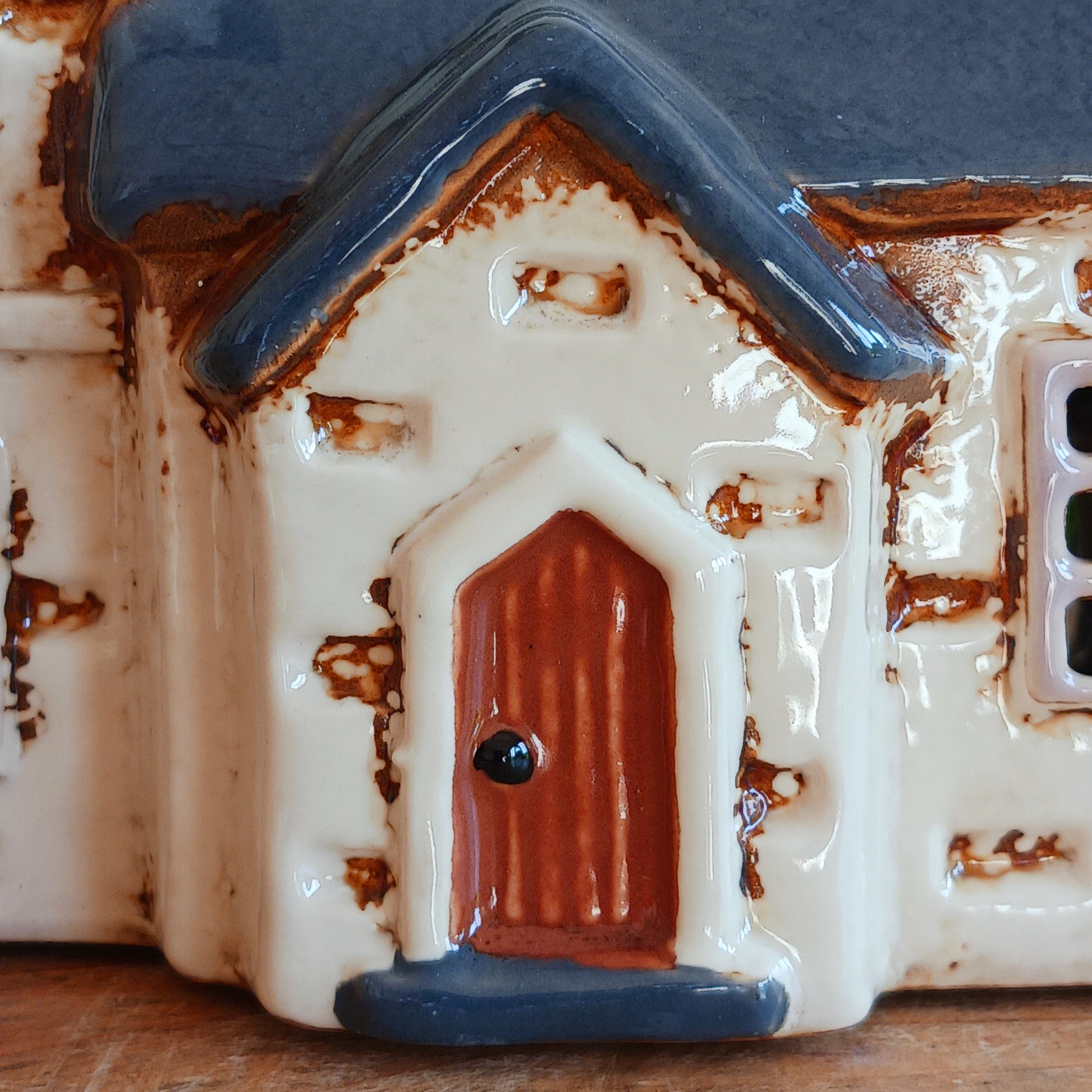 Add timeless charm to your home with the Village Pottery Steeple Church Tealight Holder. Beautifully hand-finished, each ceramic piece is unique and full of character. When a tealight is placed inside, a warm, cosy glow shines through the delicate church windows, creating a magical ambiance. 