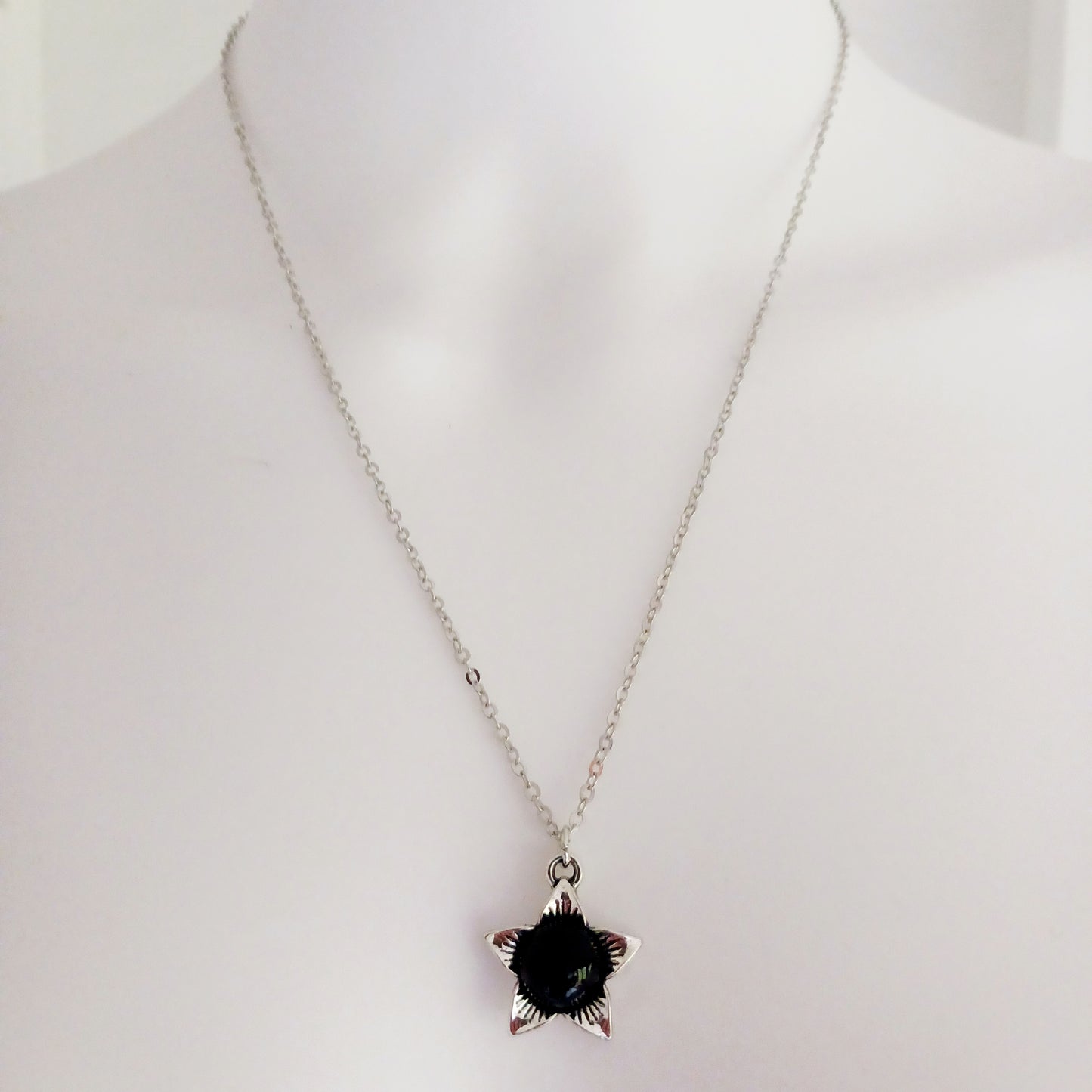 The Deadly Nightshade Necklace with Black Obsidian is a piece of dark elegance, blending nature’s shadowed beauty with gothic symbolism.