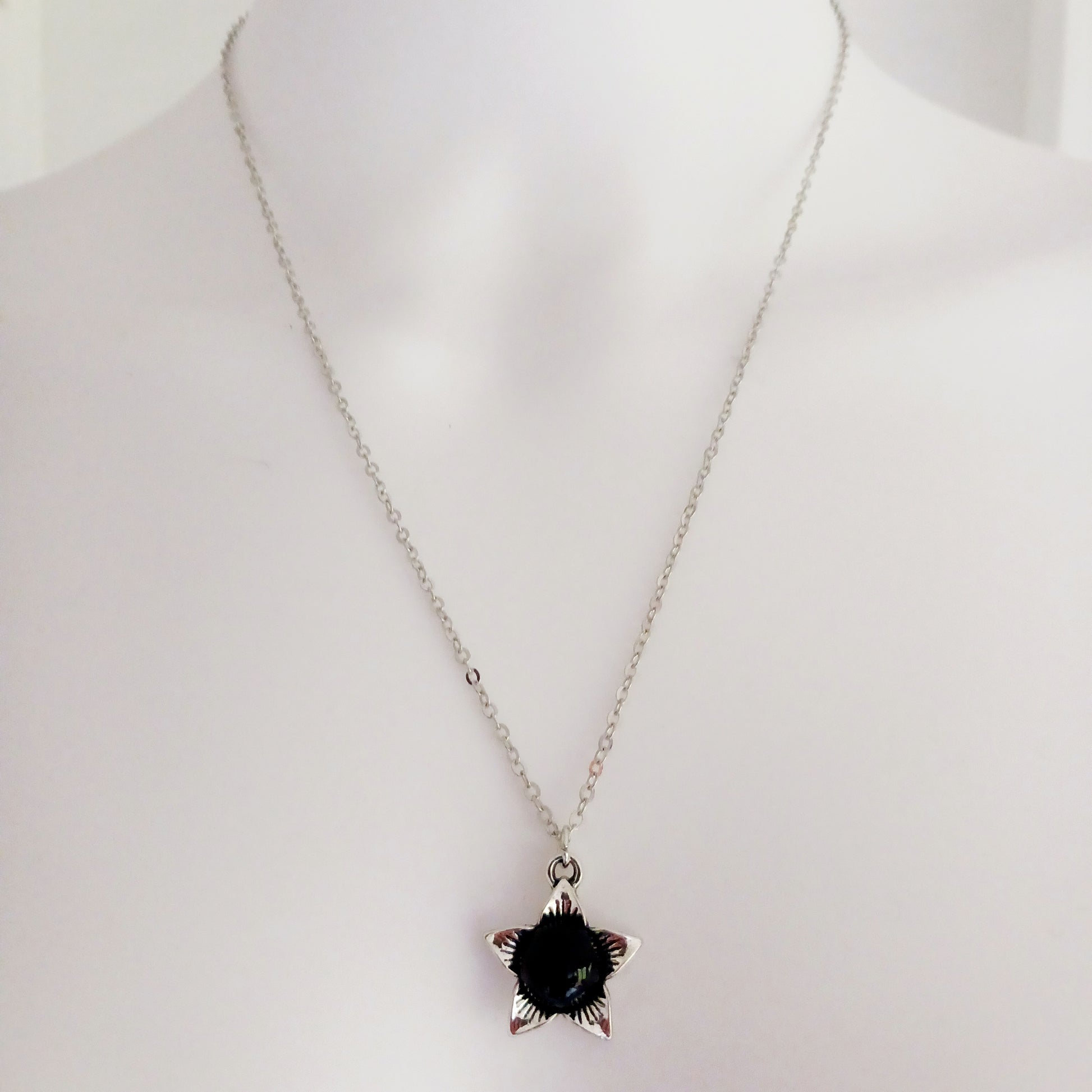 The Deadly Nightshade Necklace with Black Obsidian is a piece of dark elegance, blending nature’s shadowed beauty with gothic symbolism.