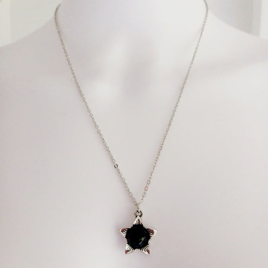 The Deadly Nightshade Necklace with Black Obsidian is a piece of dark elegance, blending nature’s shadowed beauty with gothic symbolism.