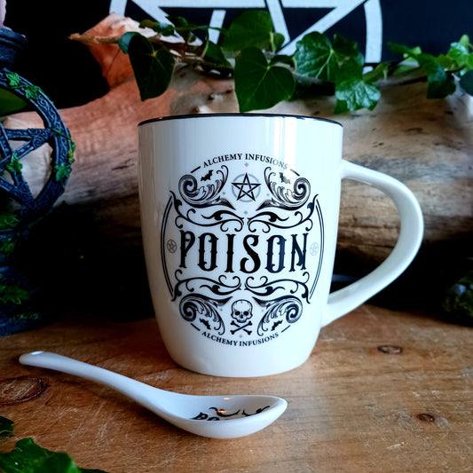 The Poison Mug &amp; Spoon Set by Alchemy is crafted for those who know that beauty can deceive and danger can delight. Made from fine white bone china, this striking mug features intricate Alchemy artwork rich with symbolism — skull and crossbones, pentagrams, tiny bats, and ornate swirling patterns that whisper of alchemy, temptation, and forbidden power.
