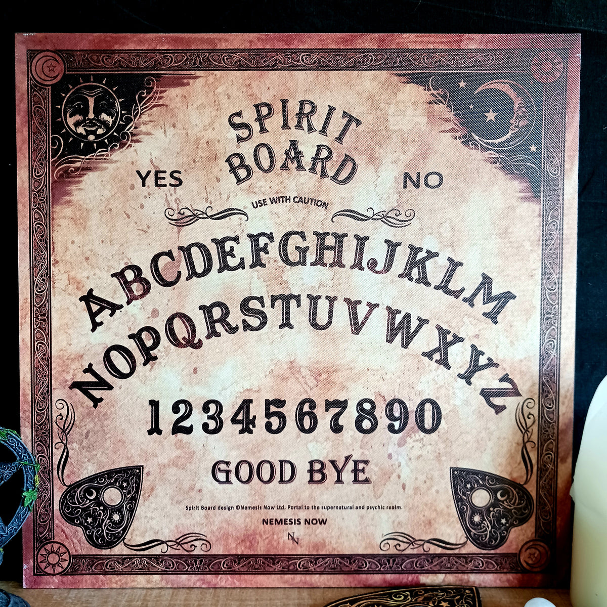 Explore the mysterious world of the occult with this Antiqued Beige Spirit Board, designed by renowned fantasy artist Lisa Parker in partnership with Nemesis Now. With its aged sepia finish and intricate baroque-style border, this atmospheric spirit board makes a striking addition to an occult collection, altar or gothic-inspired home.