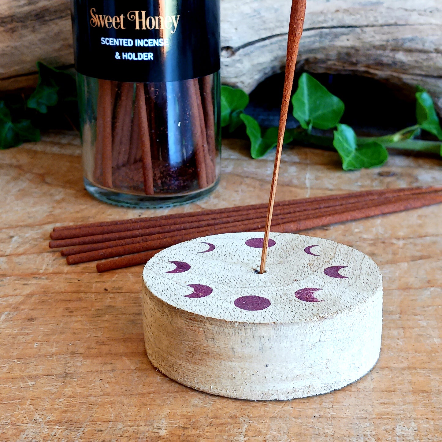 Immerse your senses in the comforting aroma of Dark Forest Sweet Honey Incense Sticks. This set includes 20 high-quality incense sticks with a soothing sweet honey fragrance, known for its calming and cozy properties. Each tube features a mystical forest bee design and comes with a reusable wooden lid that doubles as a practical incense holder. Perfect for meditation, relaxation, or simply adding a warm and inviting atmosphere to your home.