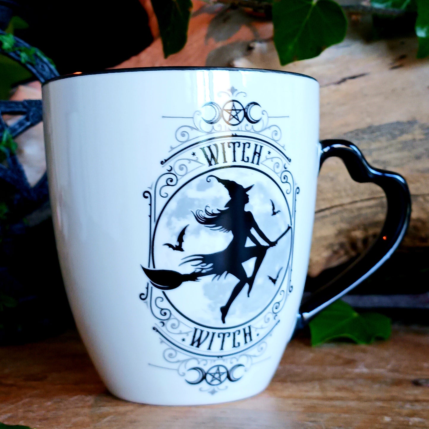 When the moon rises and the stars awaken, the Midnight Witch takes flight. Glide through twilight skies with this enchanting Witch Mug by Alchemy, a perfect blend of gothic charm and whimsical magic.