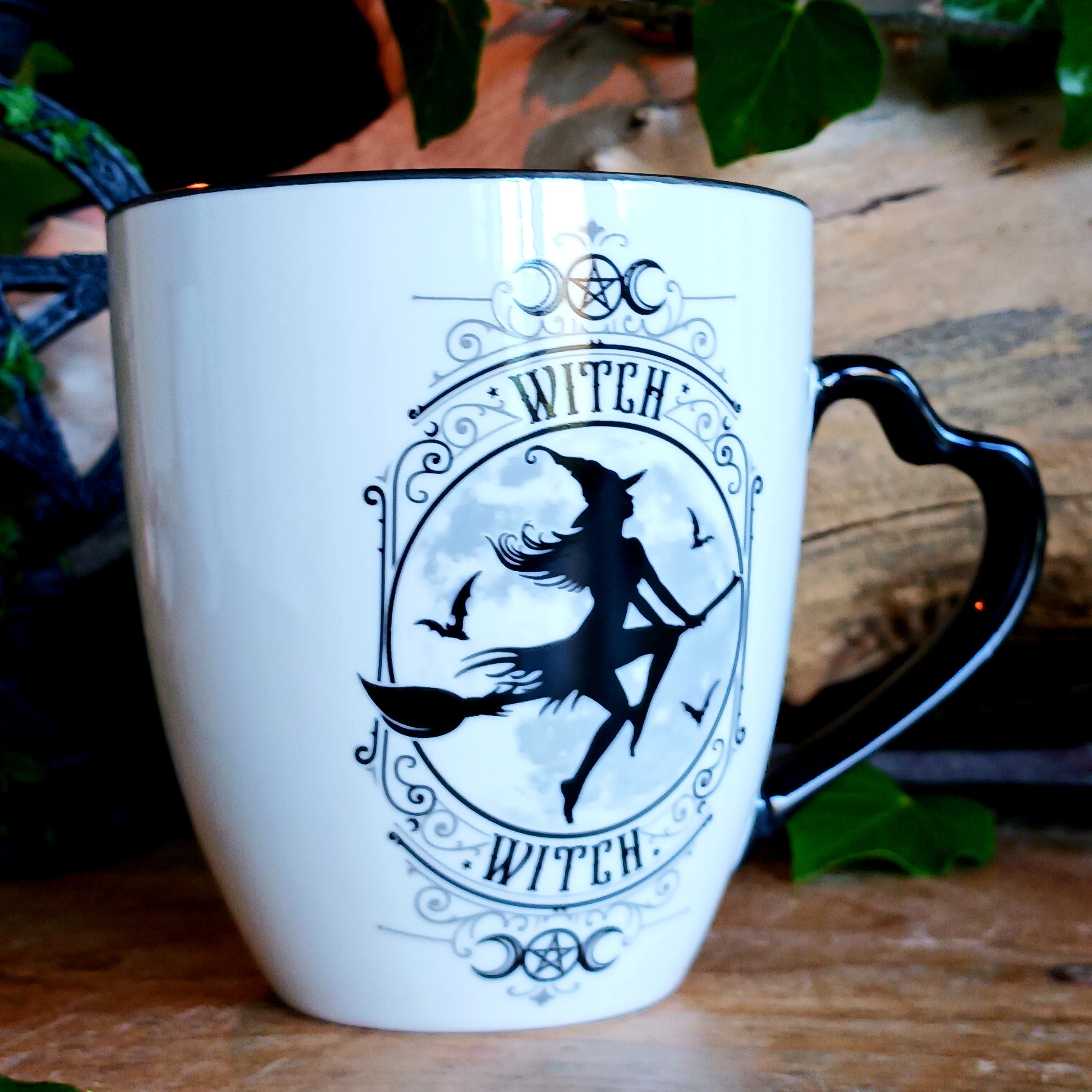 When the moon rises and the stars awaken, the Midnight Witch takes flight. Glide through twilight skies with this enchanting Witch Mug by Alchemy, a perfect blend of gothic charm and whimsical magic.