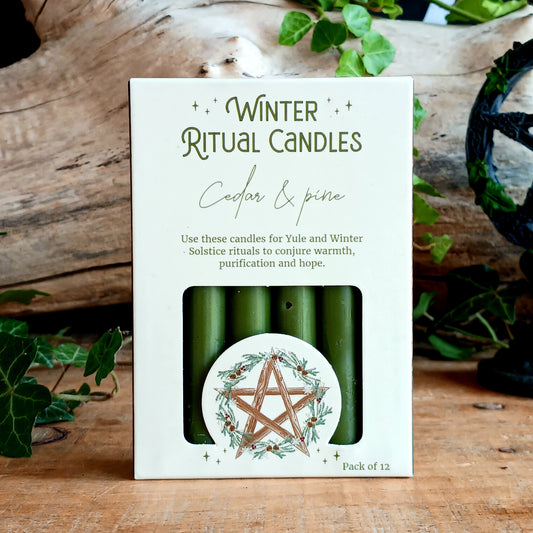 Celebrate the magic of the winter season with this pack of 12 Winter Ritual Candles, beautifully scented with a rich Cedar &amp; Pine fragrance. Inspired by the ancient pagan festival of Yule and the Winter Solstice, these candles are perfect for creating a sacred atmosphere during seasonal rituals, meditation, intention setting, and spiritual practices.