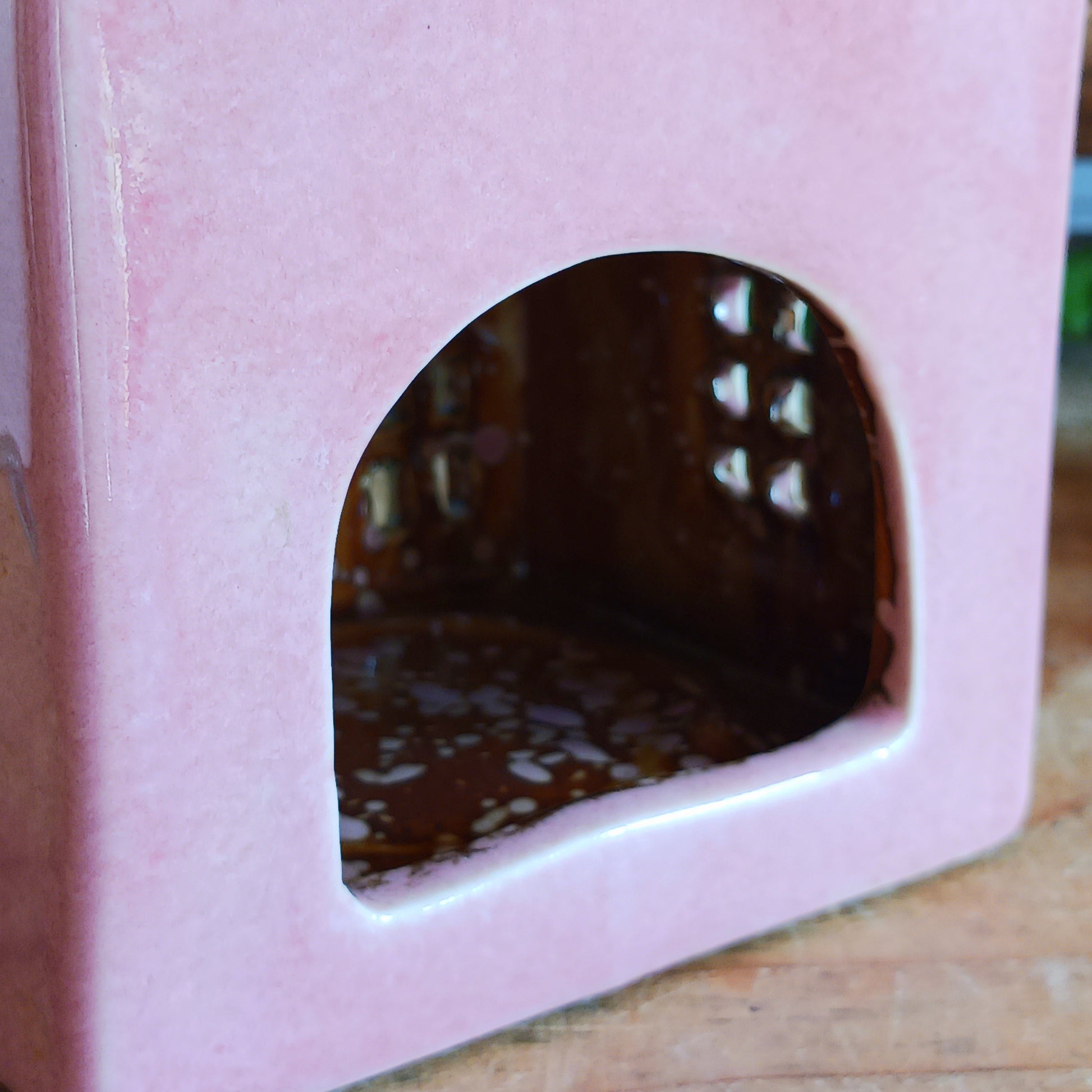 Illuminate your home with the charming Village Pottery Café Tealight Holder. Handcrafted with a rustic pink finish, this cosy piece adds warmth and ambience to any room. Perfect for tealights or simply as a decorative ornament, it’s a delightful addition to shelves, windowsills, or coffee tables. Pair with other pieces from the Village Pottery Collection to create your own quaint, decorative village.