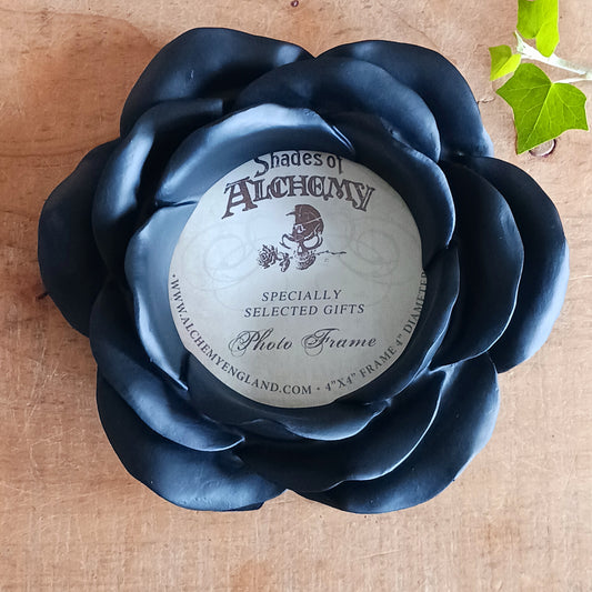 Add a touch of dark romance to your home with the Night Rose Photo Frame. Shaped like a blooming rose, this striking black resin picture frame features beautifully layered petals that create a sculptural floral border around your favourite photograph.