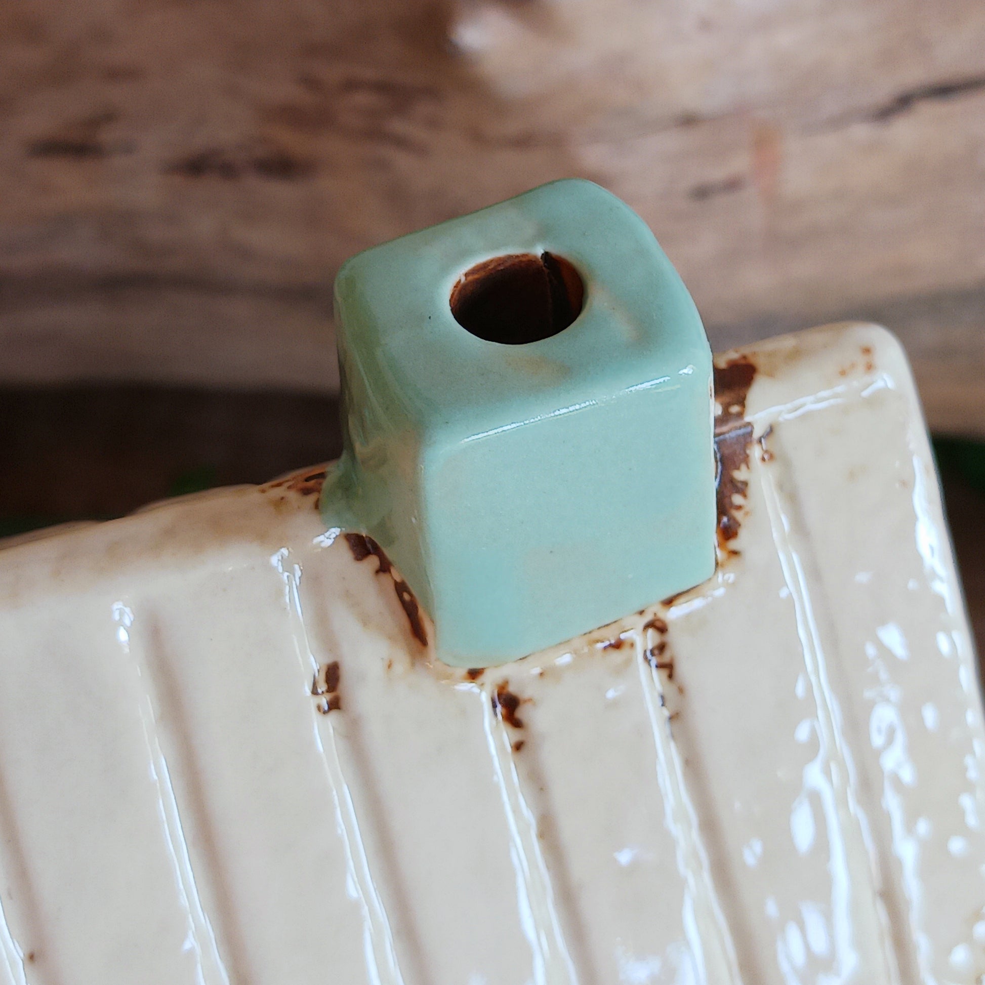 Transform your home into a warm and inviting sanctuary with the Village Pottery Gift Shop Tealight Holder. Crafted from quality ceramic, this charming piece creates a cosy, nostalgic glow when lit with a tealight. More than just a candle holder, it doubles as a delightful decorative ornament for your coffee table, shelf, or windowsill.