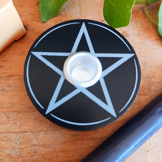 Featuring a striking Pentagram design, this spell candle holder is perfectly sized for holding a single spell candle while it burns during magical workings, rituals and spell casting. A practical and atmospheric addition to any witchcraft altar, sacred space or mystical home décor collection.