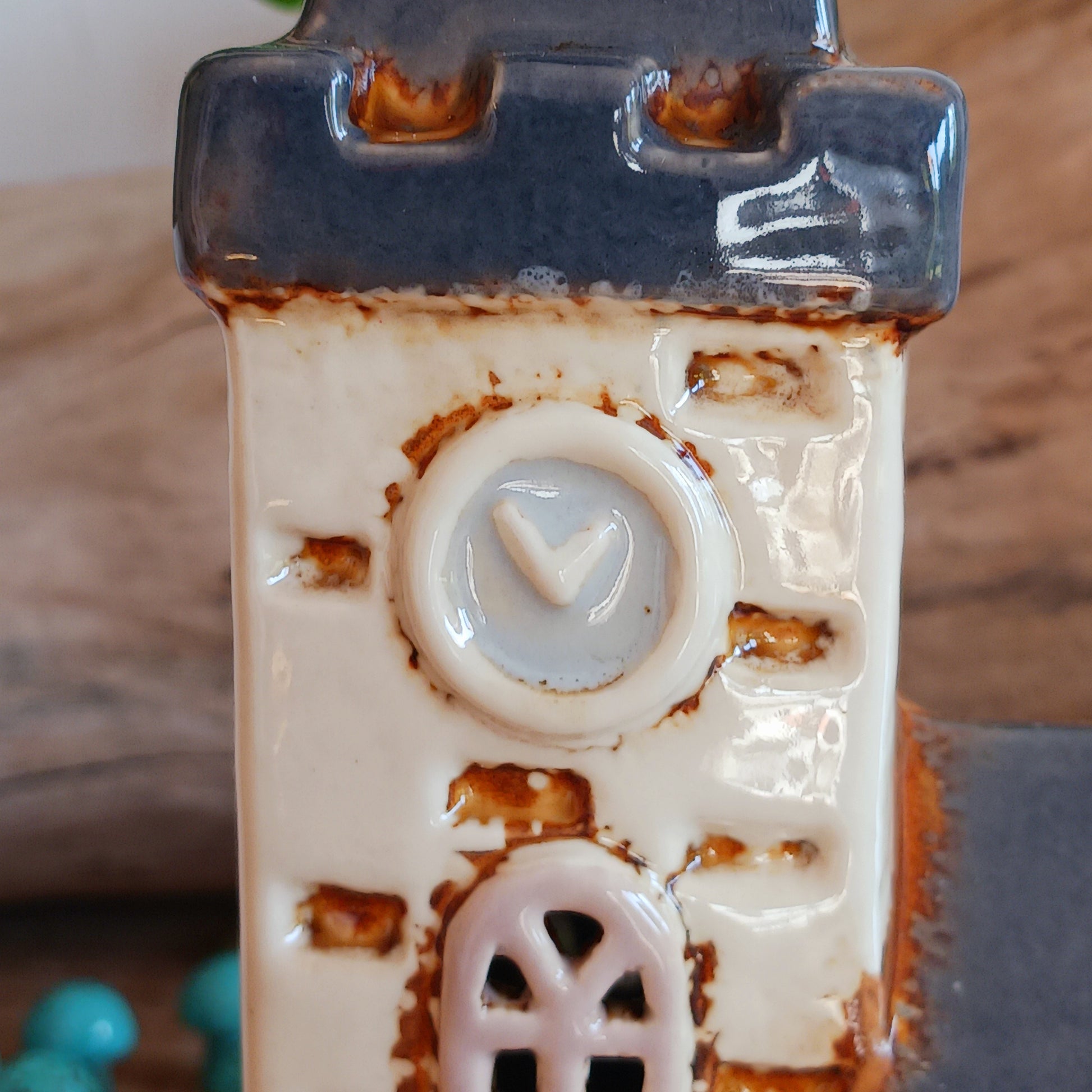 Add timeless charm to your home with the Village Pottery Steeple Church Tealight Holder. Beautifully hand-finished, each ceramic piece is unique and full of character. When a tealight is placed inside, a warm, cosy glow shines through the delicate church windows, creating a magical ambiance. 