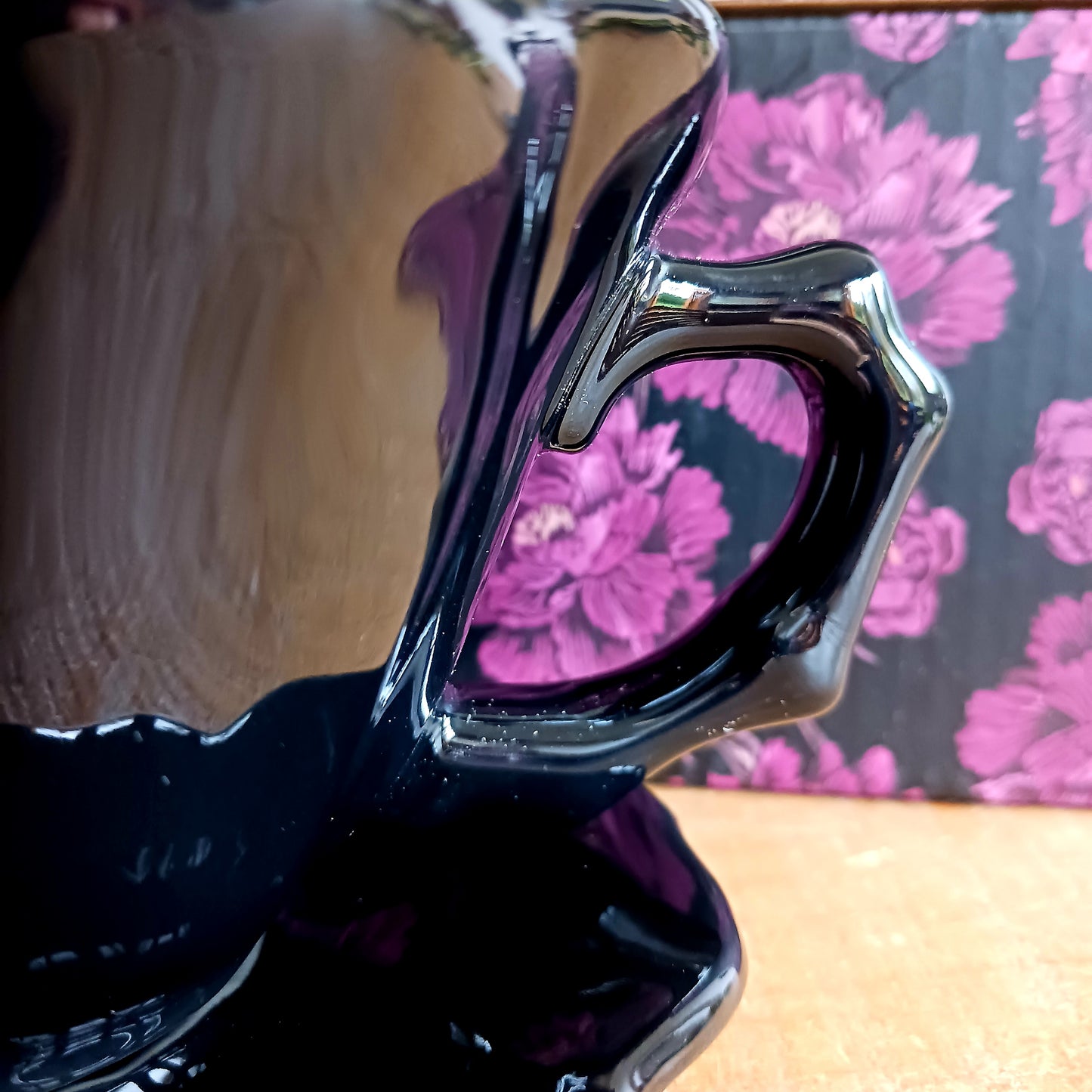 Summon timeless elegance with this black ceramic teacup and matching saucer, sculpted in the likeness of a dark, blooming rose. Designed with a dramatic silhouette and intricate petal detailing, this tea set transforms every sip into a ritual of gothic grace.