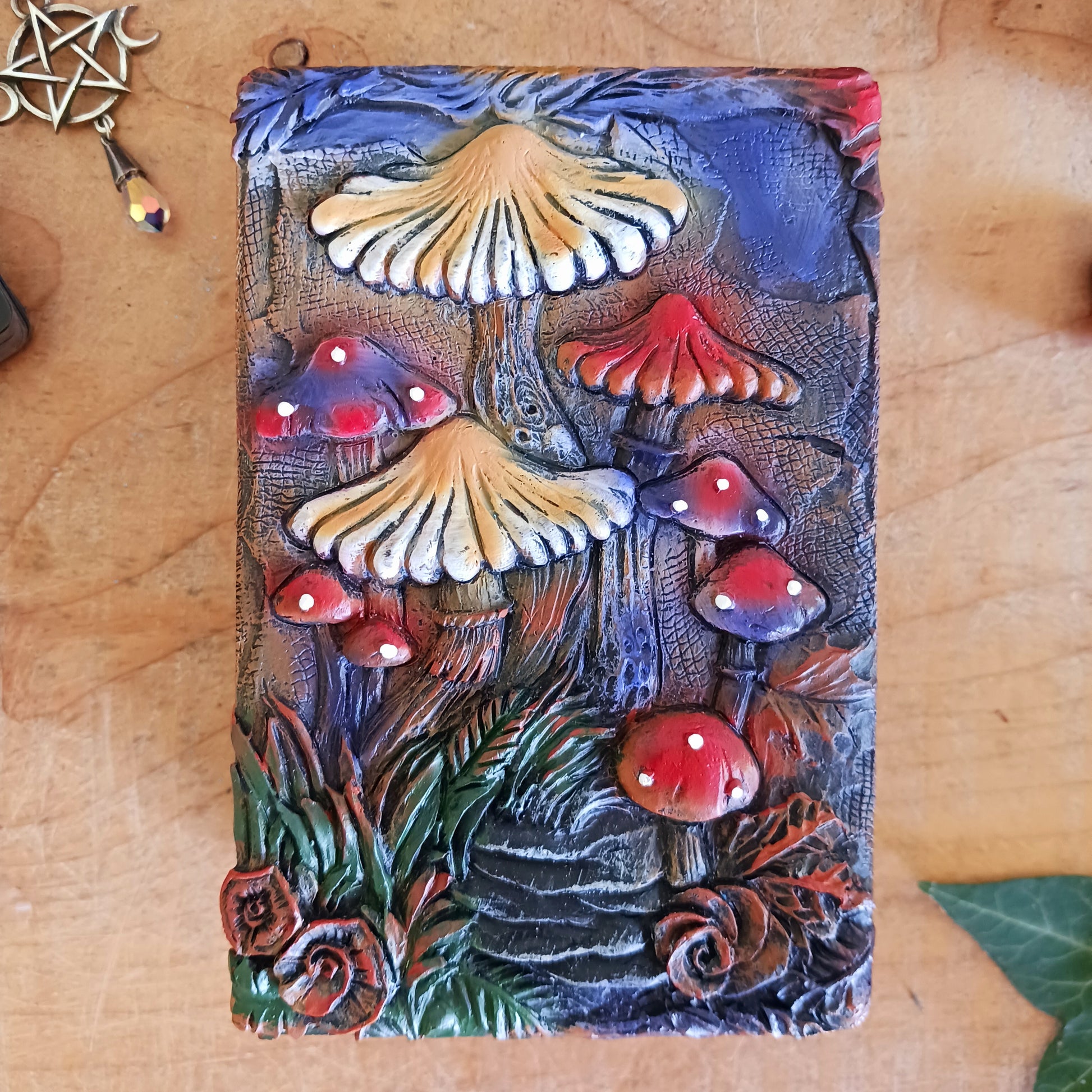 Bring a touch of mystery and magic to your home with this beautiful trinket box, featuring intricate hand-painted mushroom illustrations set against a dreamy backdrop. Perfect for modern, bohemian, or eclectic spaces, it’s as functional as it is enchanting.
