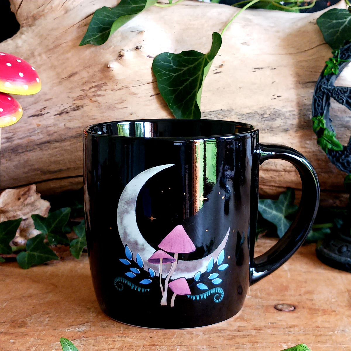 Add a touch of woodland enchantment to your morning coffee or evening tea with this beautiful Dark Forest Moon Ceramic Mug. Crafted from black ceramic, this mystical mug features an intricate enchanted forest design inspired by the beauty and mystery of the night.