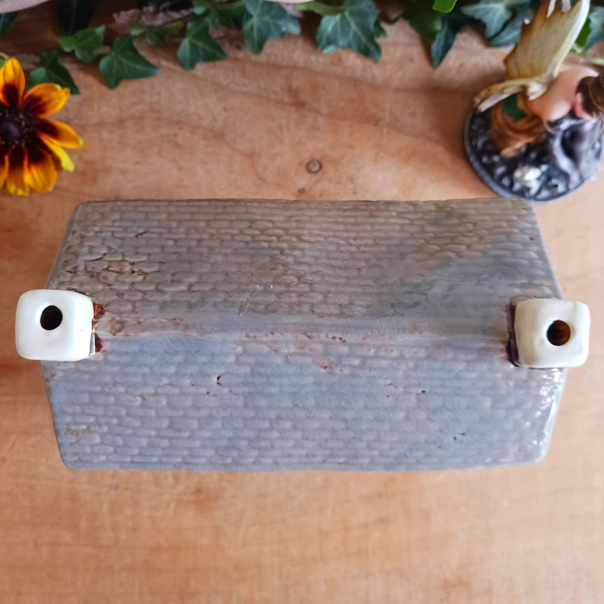Bring a little British village charm into your home with this delightful Village Tavern Tealight Holder, beautifully hand-crafted in ceramic and hand-painted with charming, characterful details.