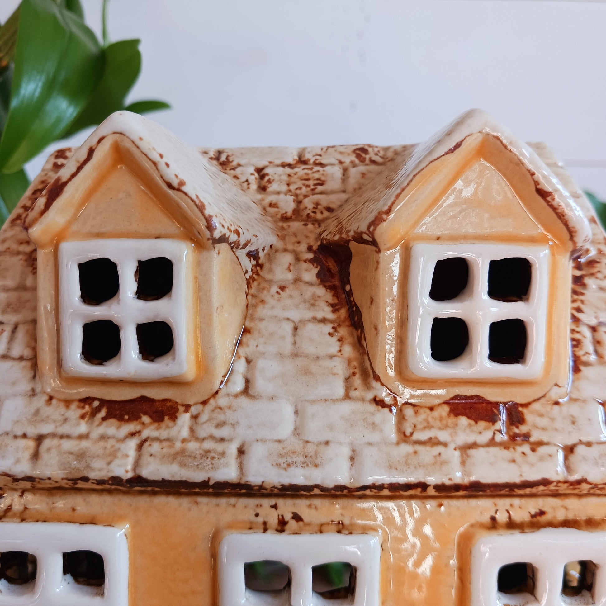 Transform your home into a warm and inviting sanctuary with the Village Pottery Tea Rooms Tealight Holder. Crafted from quality ceramic, this charming rustic piece creates a cosy, nostalgic glow when lit with a tealight. More than just a candle holder, it doubles as a delightful decorative ornament for your coffee table, shelf, or windowsill. 