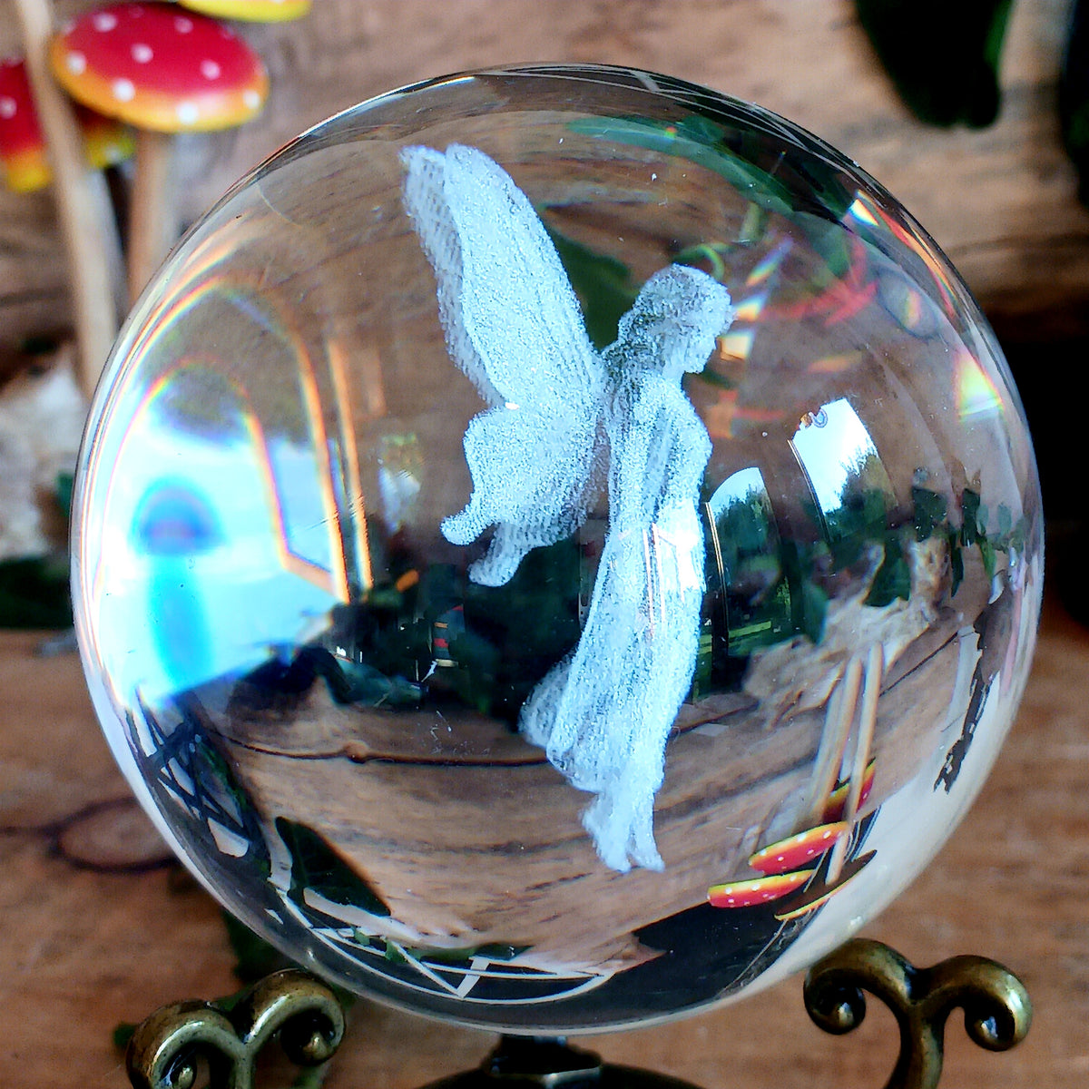 Capture a little woodland magic with this beautiful fairy crystal ball ornament, featuring an ethereal fairy figure delicately laser engraved inside a clear glass crystal ball. Displayed on an ornate antique-style stand, it makes a charming decorative piece for anyone who loves fairies, fantasy and magical woodland-inspired interiors.
