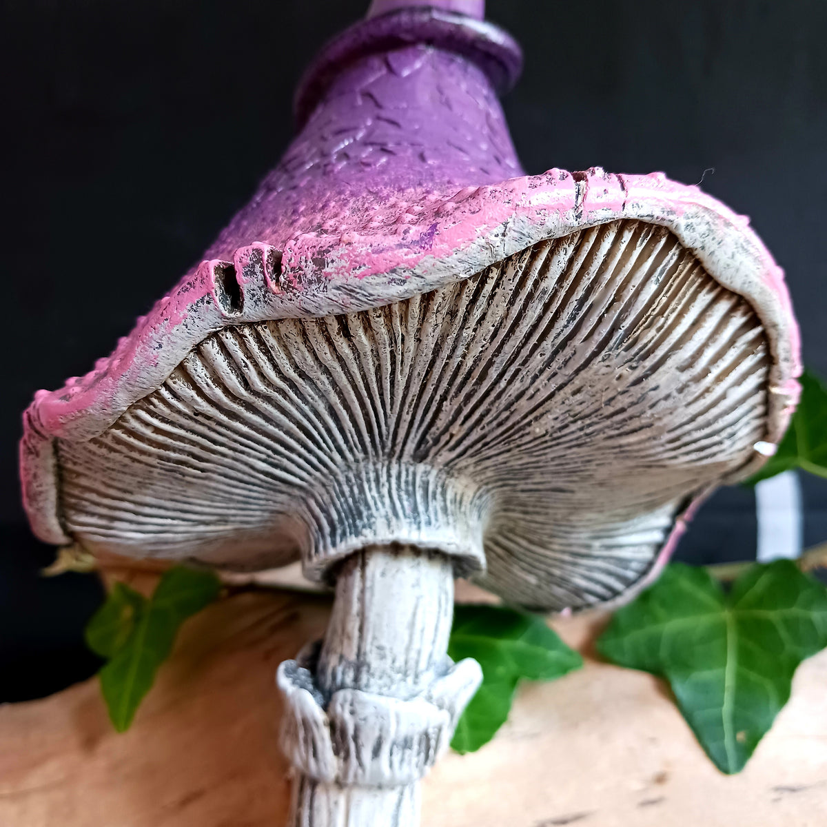 Bring a touch of magic and whimsical charm to your home with Twizzle Tumblethorne, a wonderfully quirky purple mushroom sculpture perfect for lovers of fantasy, fairies and nature-inspired decor.