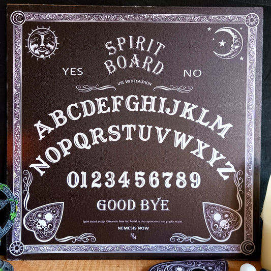 Explore the mysterious world of the occult with this Classic Black &amp; White Spirit Board by Nemesis Now. Designed with a timeless monochrome aesthetic, this traditional spirit board features an intricate baroque border and classic spiritualist details.