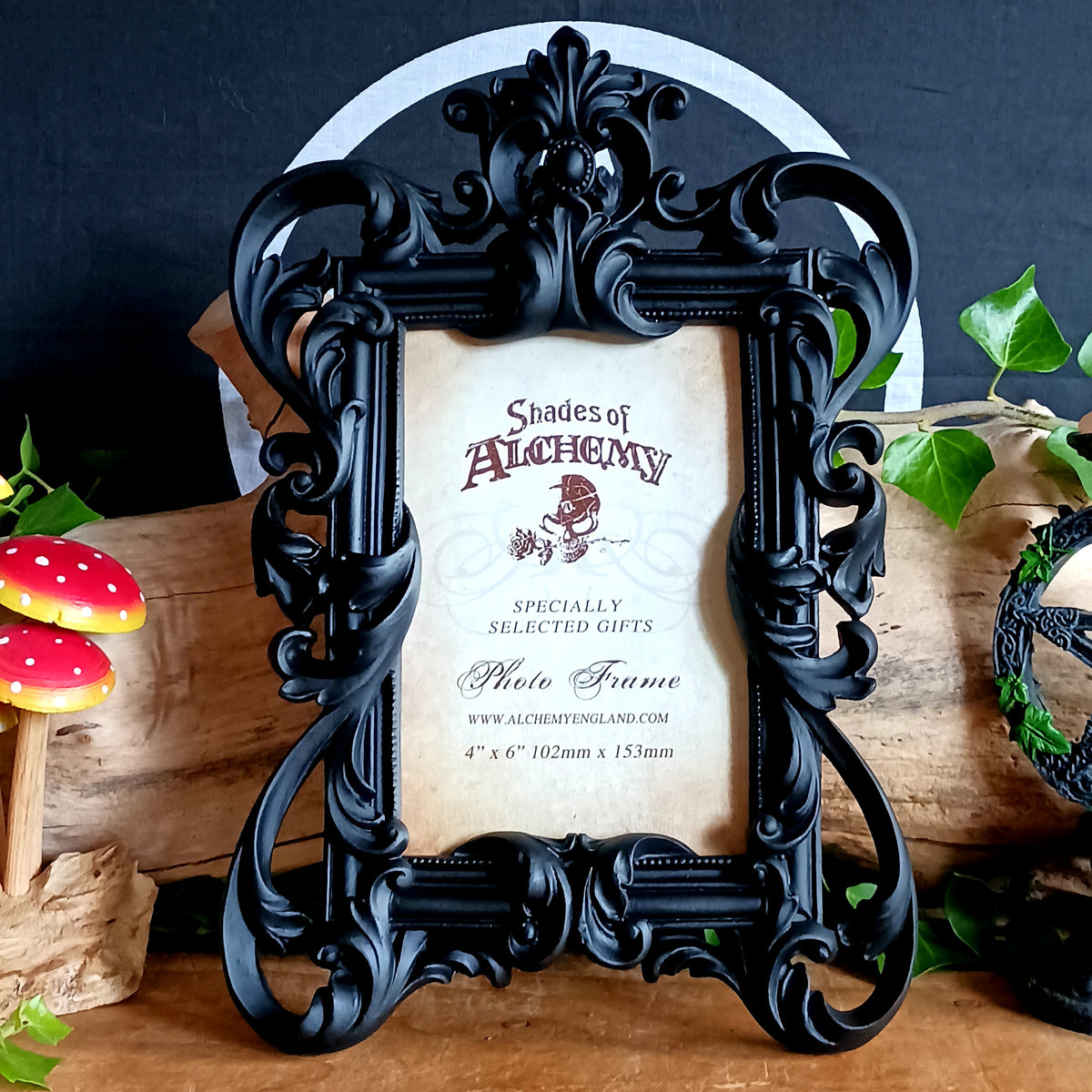Add a touch of dark elegance to your home with this ornate Black Rococo Photo Frame. Inspired by the opulence of a bygone era, this decorative resin frame features elaborate scrollwork, flowing curves and a dramatic black finish, creating a striking statement piece for gothic, vintage and alternative interiors.