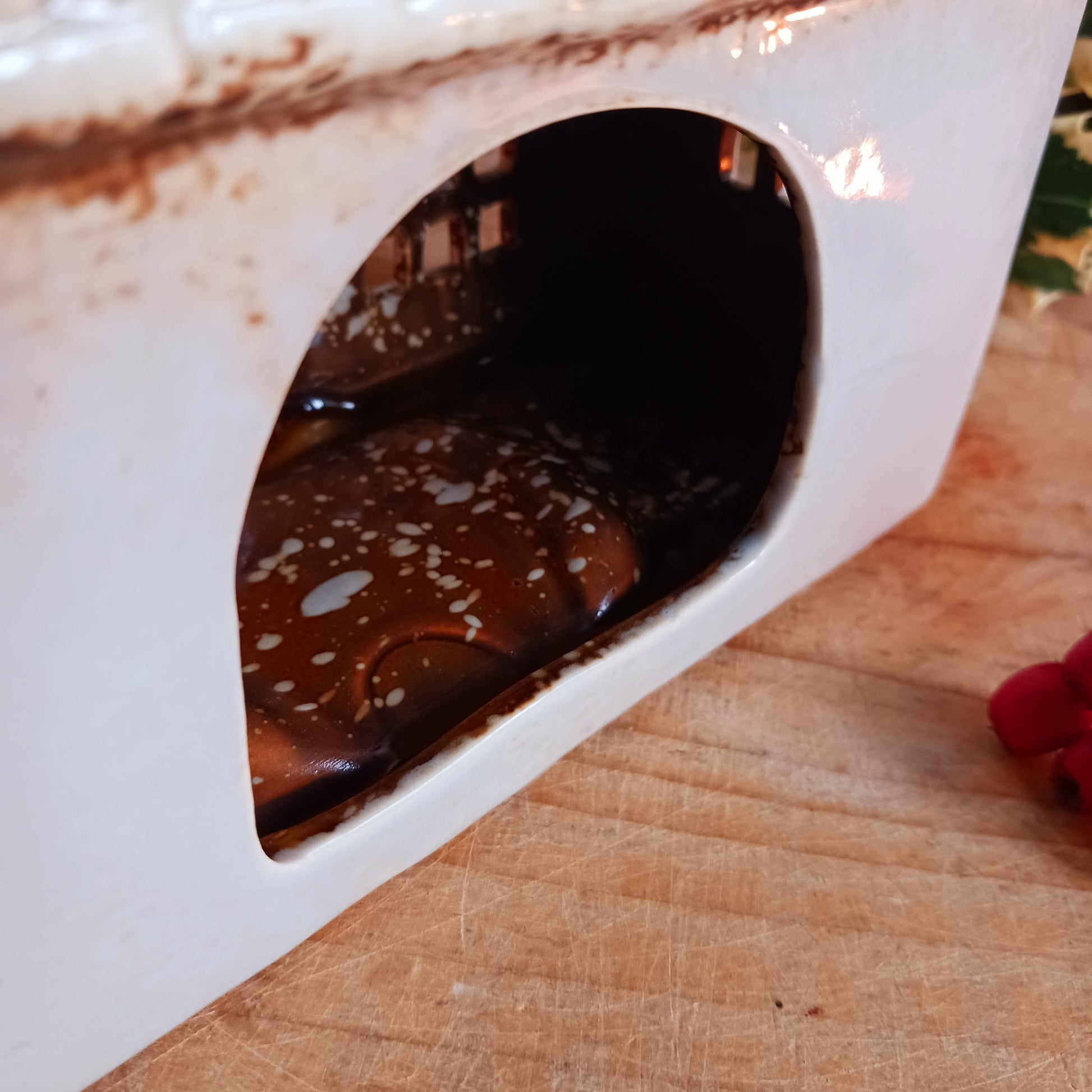 Bring the charm of traditional village life into your home with the Royal Oak Pub Ceramic Tealight Holder. Handcrafted in the Village Pottery workshop, this timeless piece features intricate detailing and rustic finishes inspired by a classic village pub.