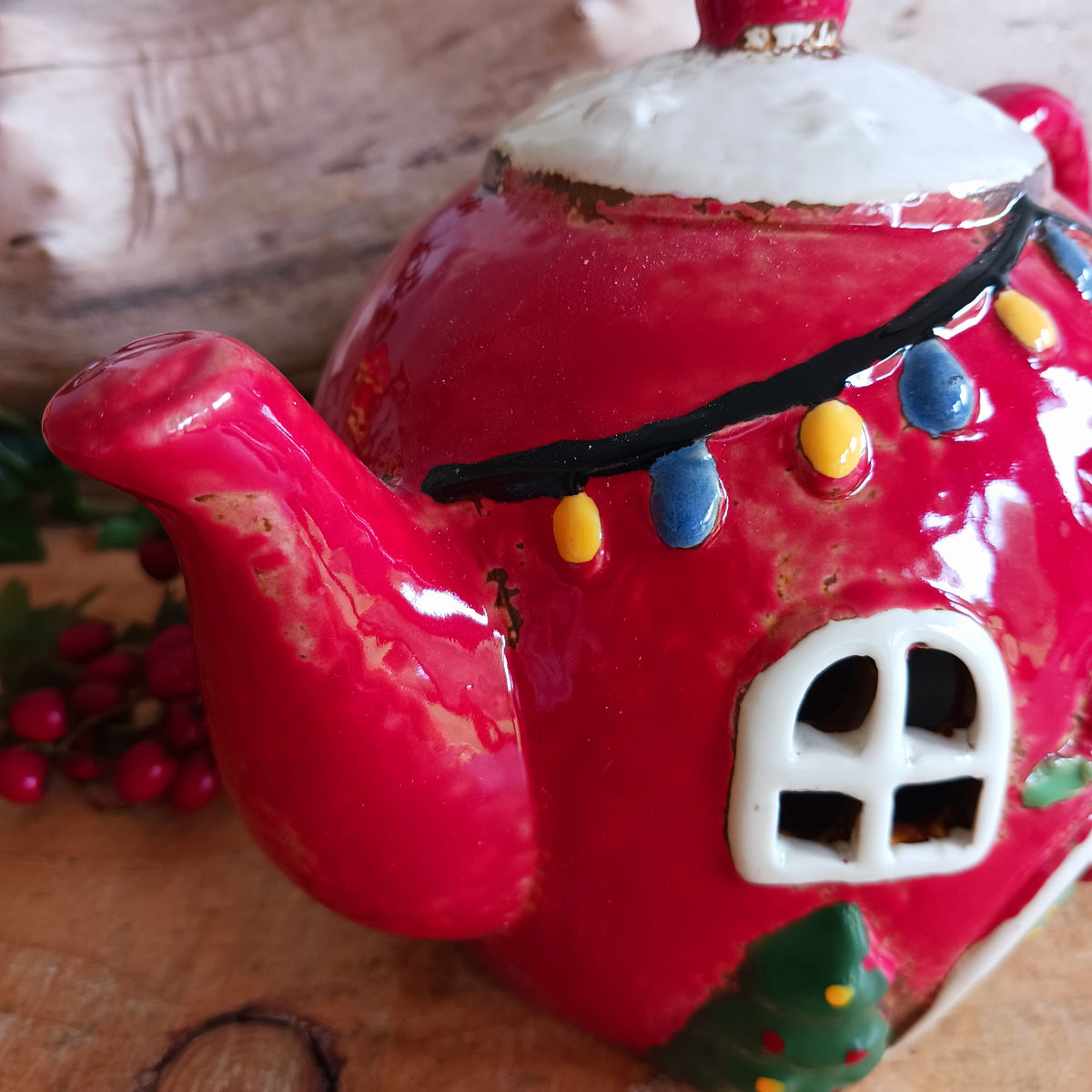 Add a touch of charm and character to your festive display with the Village Pottery Xmas Teapot House Tealight. Combining the familiar shape of a traditional teapot with the appearance of a miniature Christmas house, this unusual decorative tealight holder makes a delightful addition to your seasonal décor.