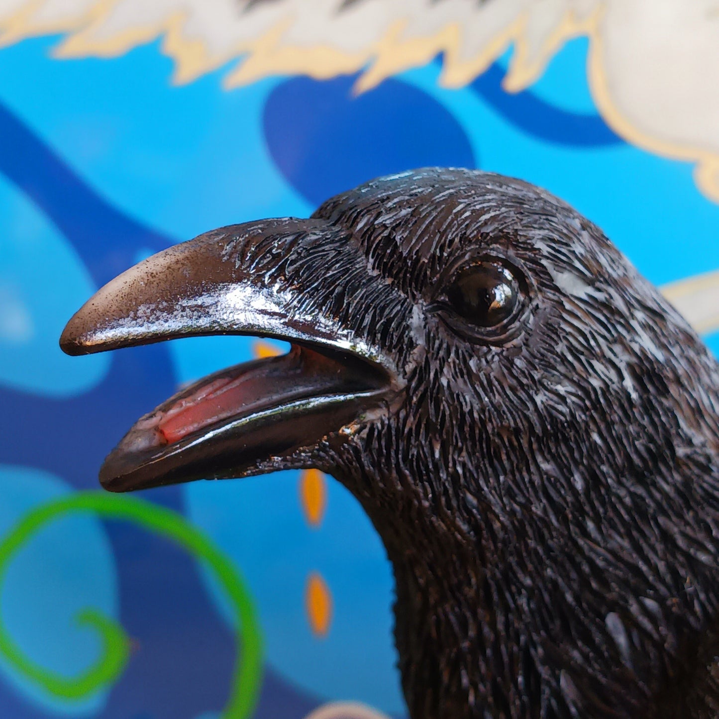 Bring a touch of mystery and nature to your space with this lifelike medium-sized raven figurine. Crafted from high-quality resin, it features meticulously detailed feathers and is perched on a base designed to resemble natural wood. The built-in motion sensor triggers an authentic raven call, adding an interactive and atmospheric element to your décor. Perfect for gothic interiors, nature-inspired arrangements, or as a distinctive gift, this captivating piece blends artistry with surprise for a truly memor