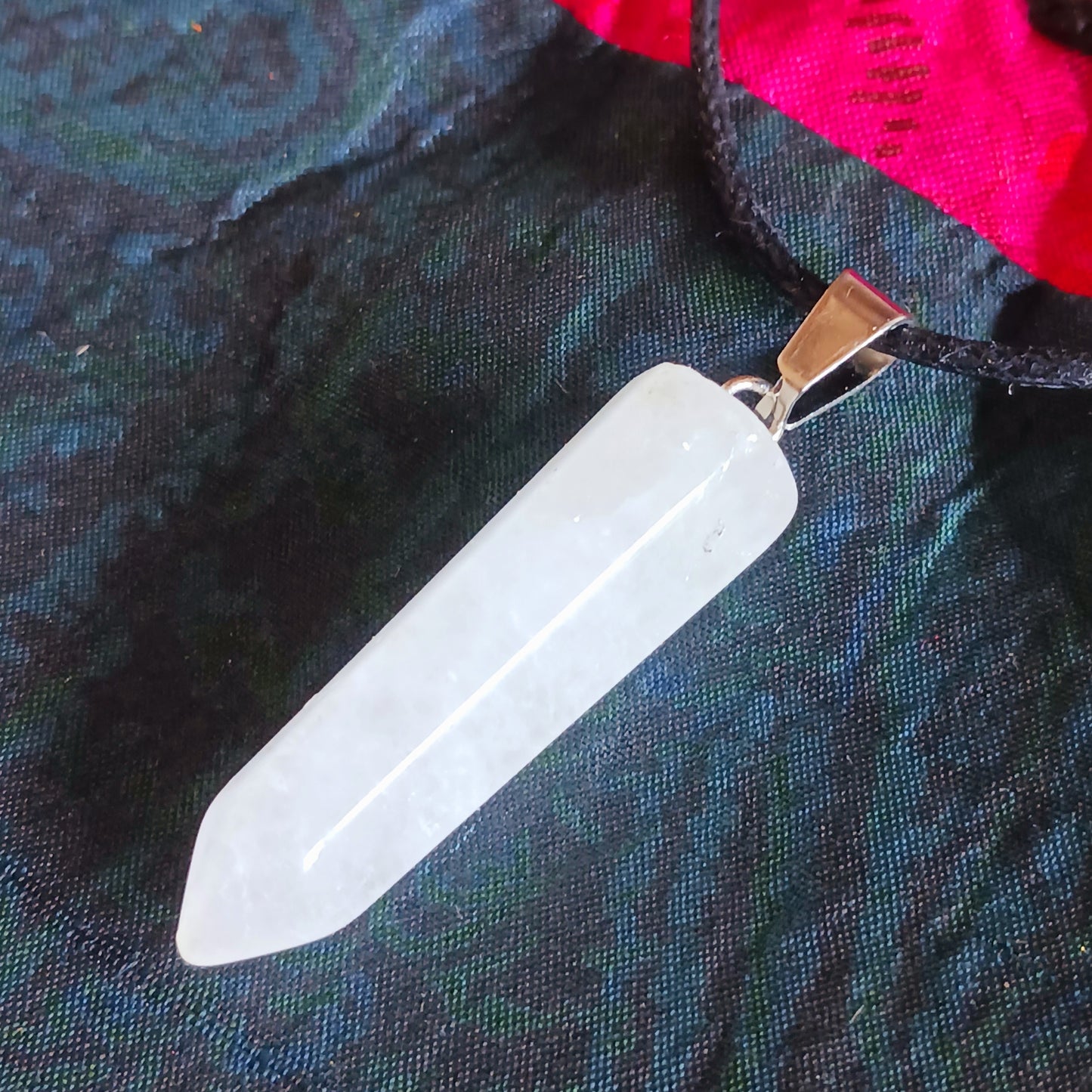 Embrace the natural power of rock crystal with this elegant pendant on a sleek black cord necklace. Known as a master healing stone, rock crystal energises the body, purifies the aura, and enhances inner strength.