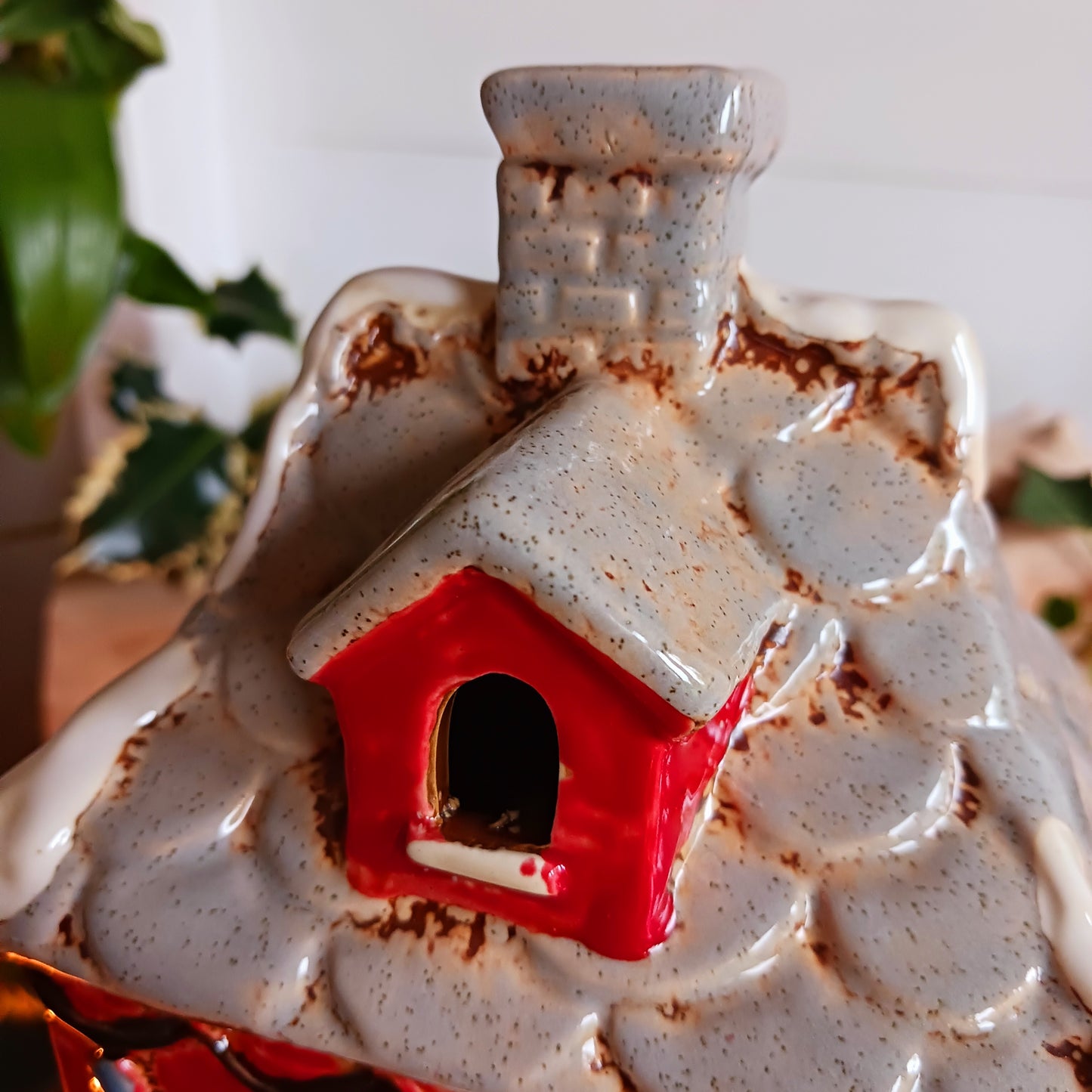 Bring the warmth and magic of Christmas into your home with this handcrafted Christmas Wreath House Tealight Holder from the Village Pottery collection. Made from high-quality ceramic and decorated with a classic wreath and rustic detailing, this piece evokes the charm of a snowy winter’s evening.