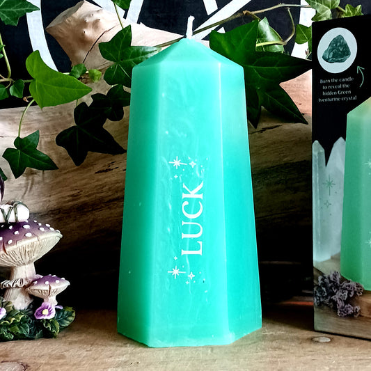 Invite prosperity, positive energy, and spiritual abundance into your space with the Luck Crystal Candle with Hidden Aventurine. Beautifully shaped like a vibrant green crystal tower, this unique candle is designed to inspire intention setting, manifestation, and mindful rituals.