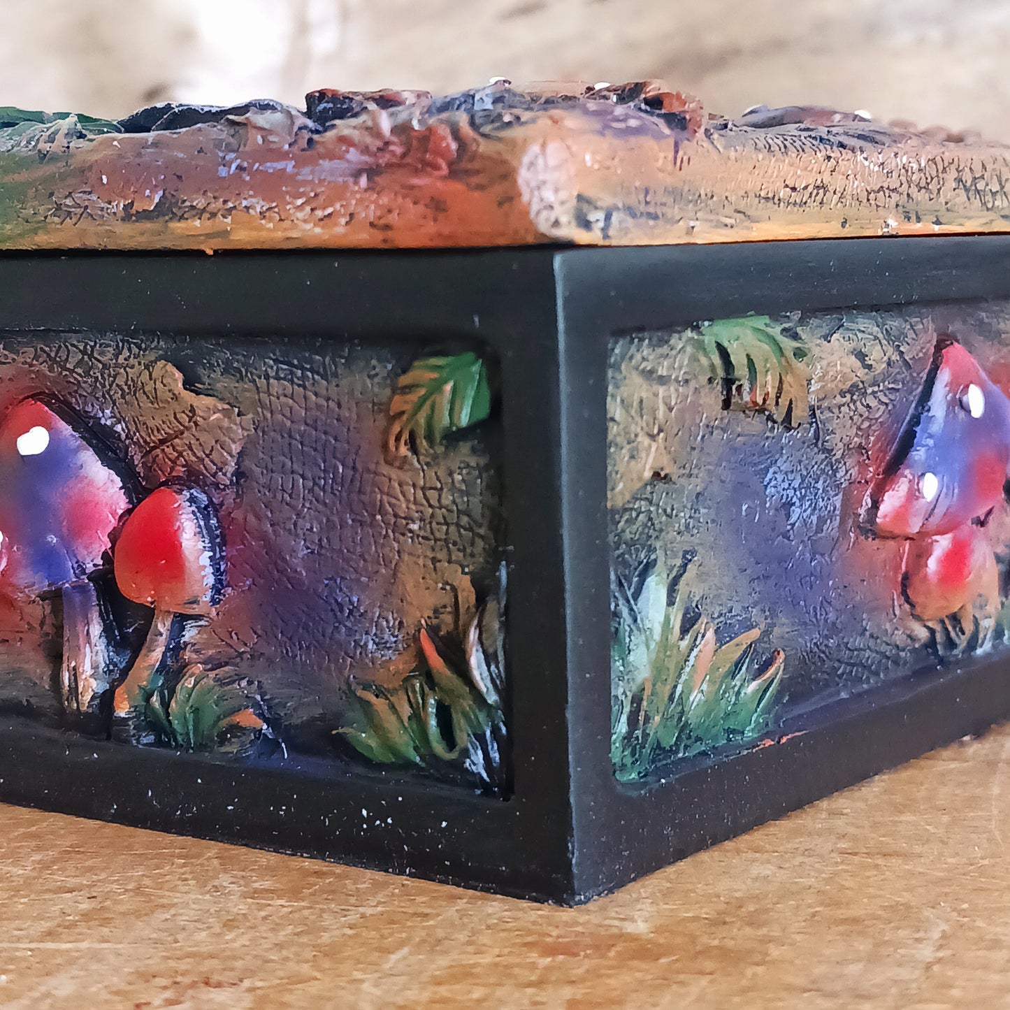 Bring a touch of mystery and magic to your home with this beautiful trinket box, featuring intricate hand-painted mushroom illustrations set against a dreamy backdrop. Perfect for modern, bohemian, or eclectic spaces, it’s as functional as it is enchanting.