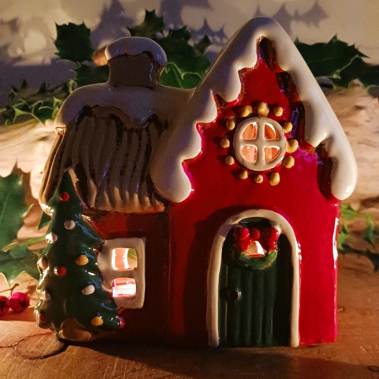 Fill your home with the warmth and wonder of the season with the&nbsp;Village Pottery Christmas Round Window House Tealight Holder, a beautifully handcrafted ceramic creation glowing with festive spirit. Measuring 14.5 x 13.5 x 8.5 cm, this charming house captures the cosy magic of a winter’s night, where light glows softly through the rounded windows like starlight in the snow.