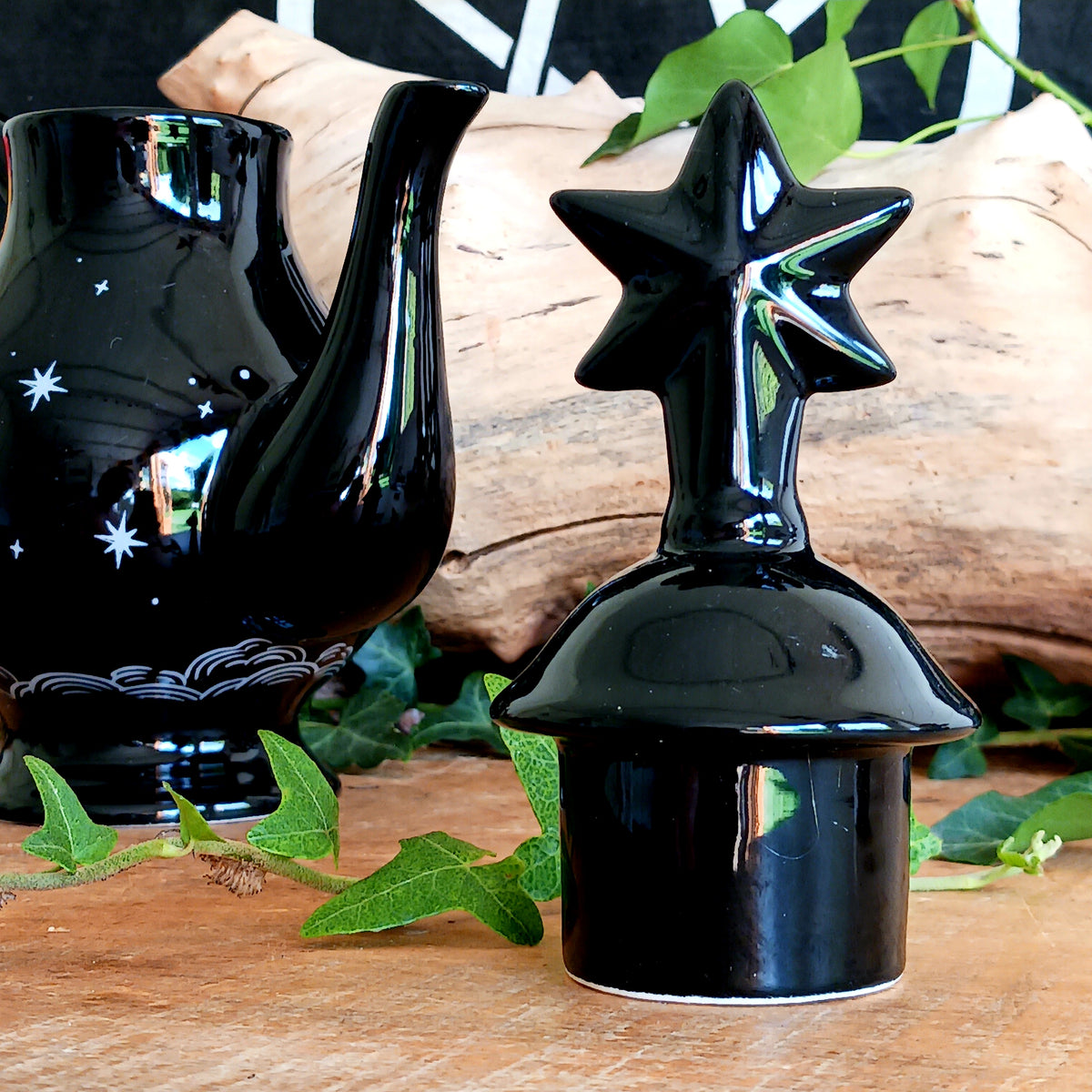 Add a touch of celestial magic to tea time with this striking black ceramic teapot, beautifully decorated with moon and star details and finished with a statement star-shaped lid.