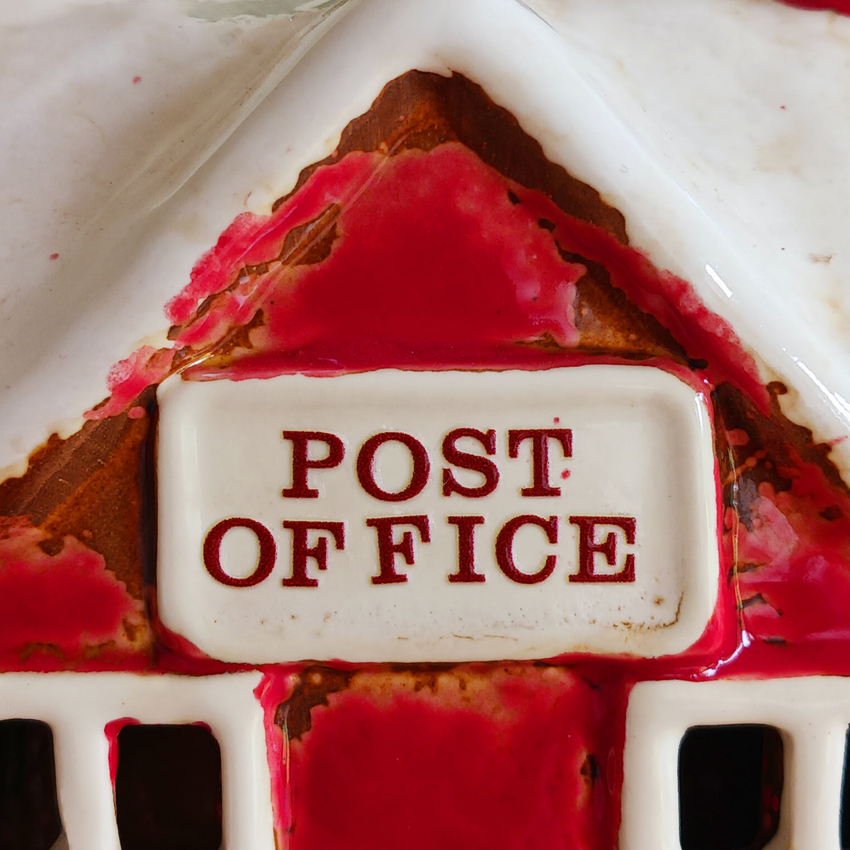 Create a cosy Christmas village scene with this charming Village Pottery Christmas Post Office Tealight Holder. Beautifully detailed as a traditional snowy village post office, it features a snow-covered roof, a post box and a delightful robin decoration for a wonderfully festive look.
