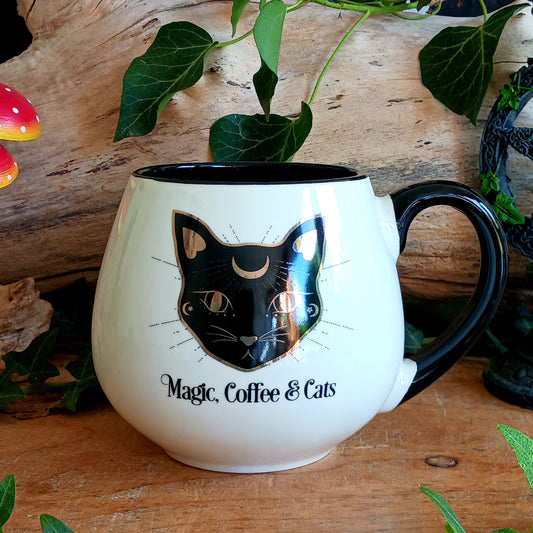 Add a little magic to your coffee break with this large mystical black cat mug, featuring a striking black cat design with elegant gold-tone accents and the enchanting words “Magic, Coffee & Cats.”