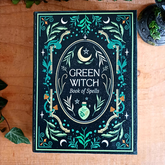 The Green Witch Book Shaped Storage Box is a mystical keepsake designed to safeguard trinkets, crystals, or secret spells.