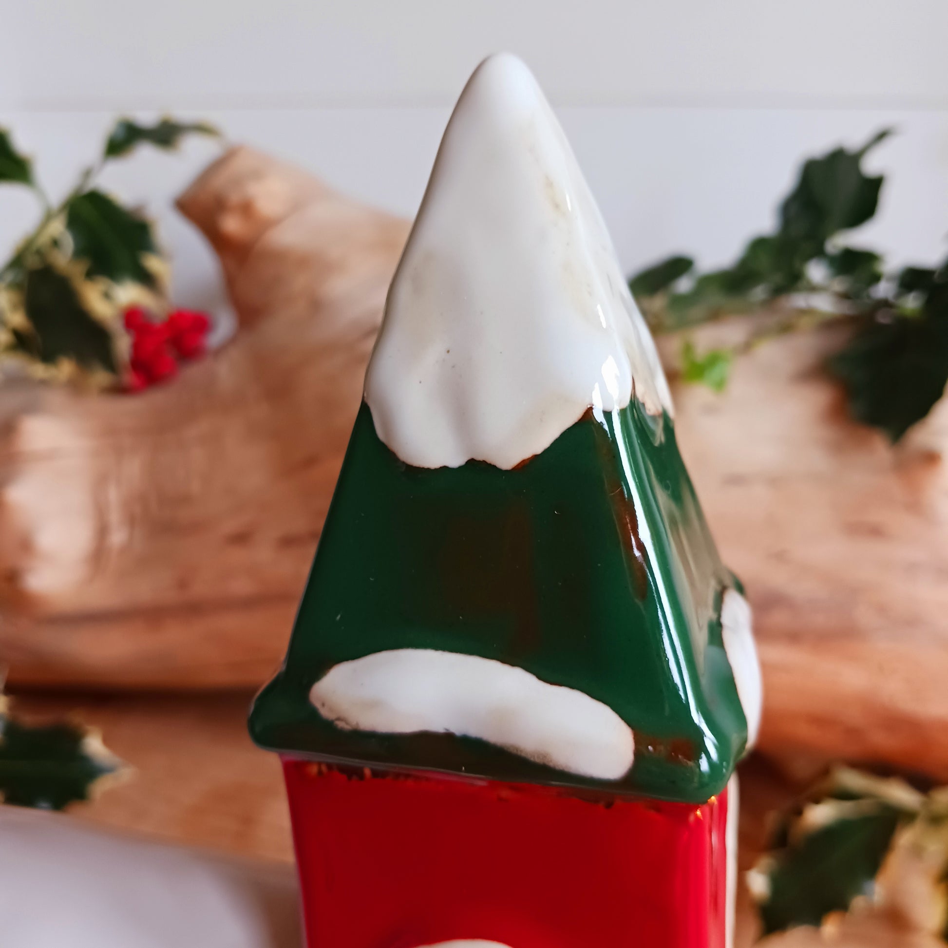 Bring festive warmth to your home with the Large Christmas Church Tealight Holder from the Village Pottery collection. This beautifully handcrafted ceramic piece features rustic detailing, evoking the charm of a snow-covered church glowing softly with candlelight.