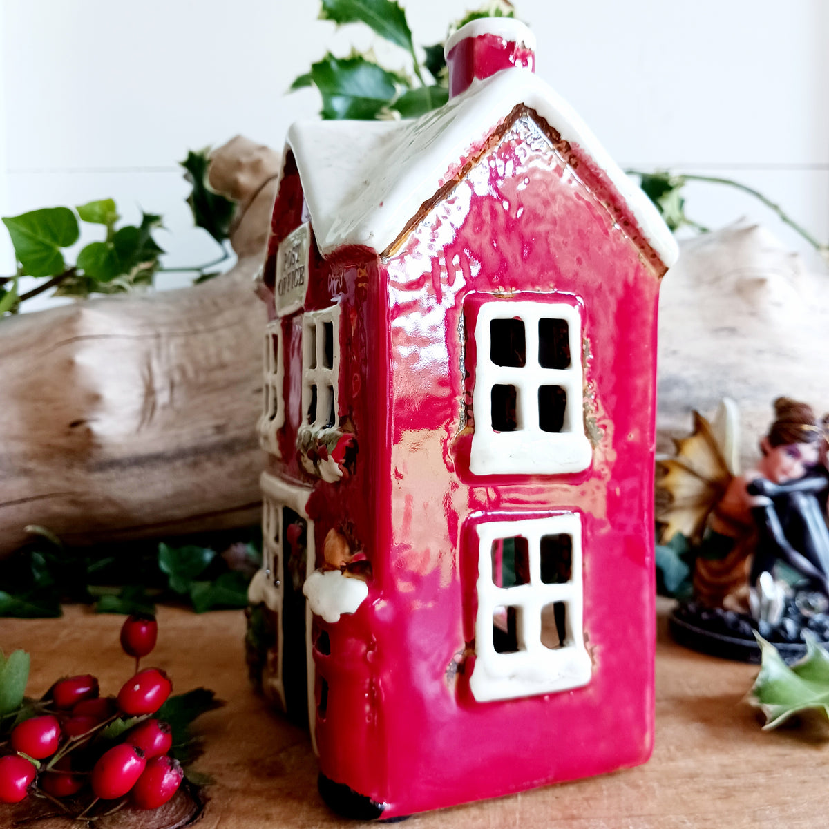 Create a cosy Christmas village scene with this charming Village Pottery Christmas Post Office Tealight Holder. Beautifully detailed as a traditional snowy village post office, it features a snow-covered roof, a post box and a delightful robin decoration for a wonderfully festive look.