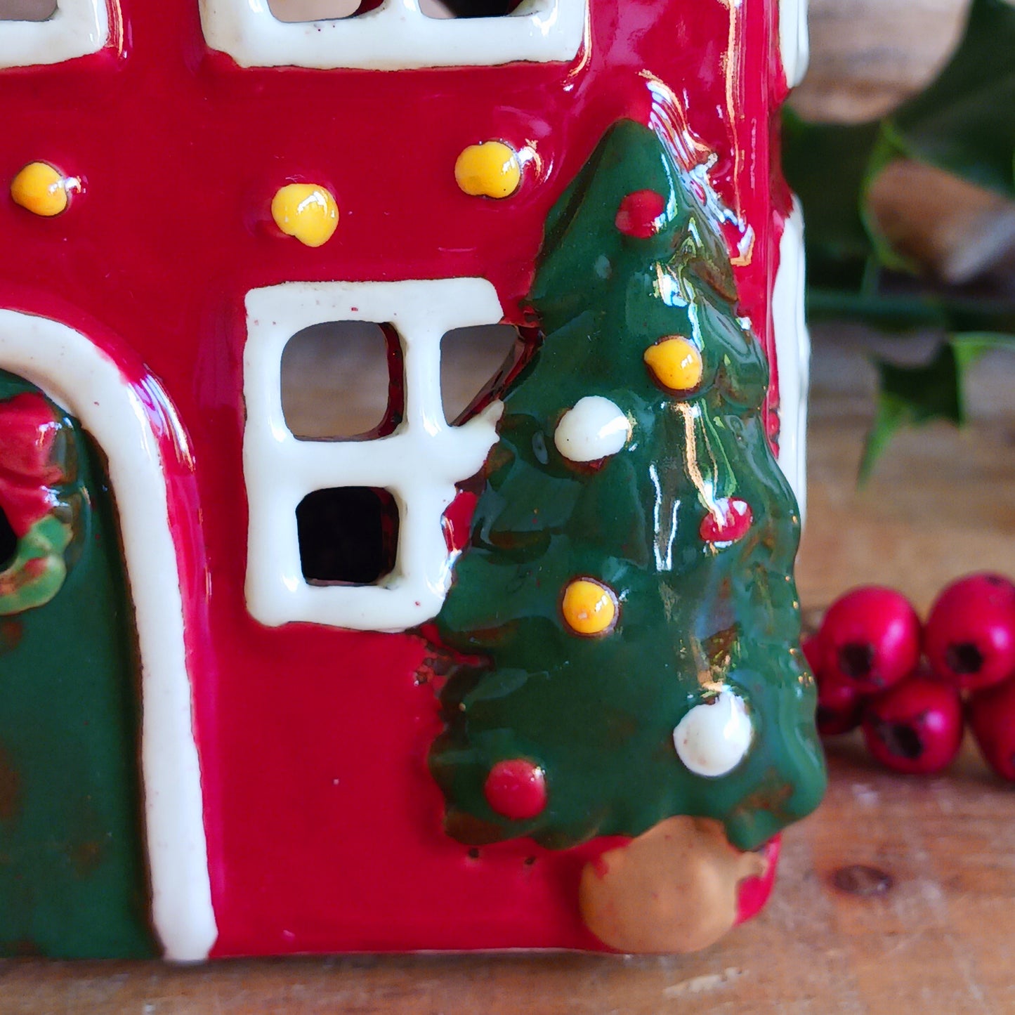 Bring timeless festive charm into your home with the Village Pottery Christmas Thatched Roof House Tealight Holder, a handcrafted ceramic cottage glowing with the spirit of the season. Measuring 17 x 12.5 x 8.5 cm, this enchanting piece captures the essence of a peaceful winter’s night — where golden candlelight flickers through snowy windows beneath a soft thatched roof.