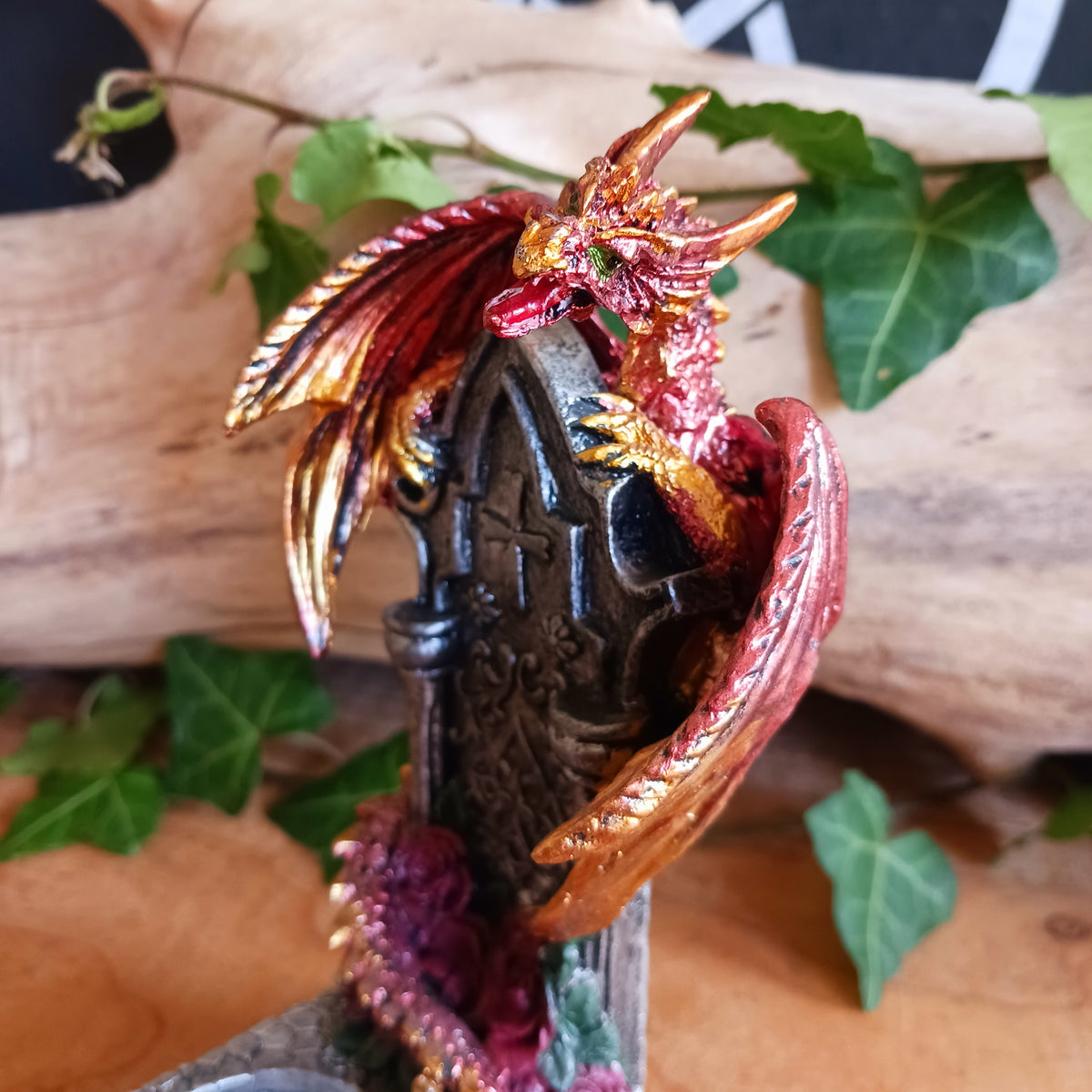 Bring a touch of mythical magic to your home with the Light of the Dragon Red Ornamental Tealight Holder. Featuring an enchanting red dragon coiled around a tombstone-style base, this intricately detailed candle holder is perfect for fantasy lovers and collectors of unusual home décor.