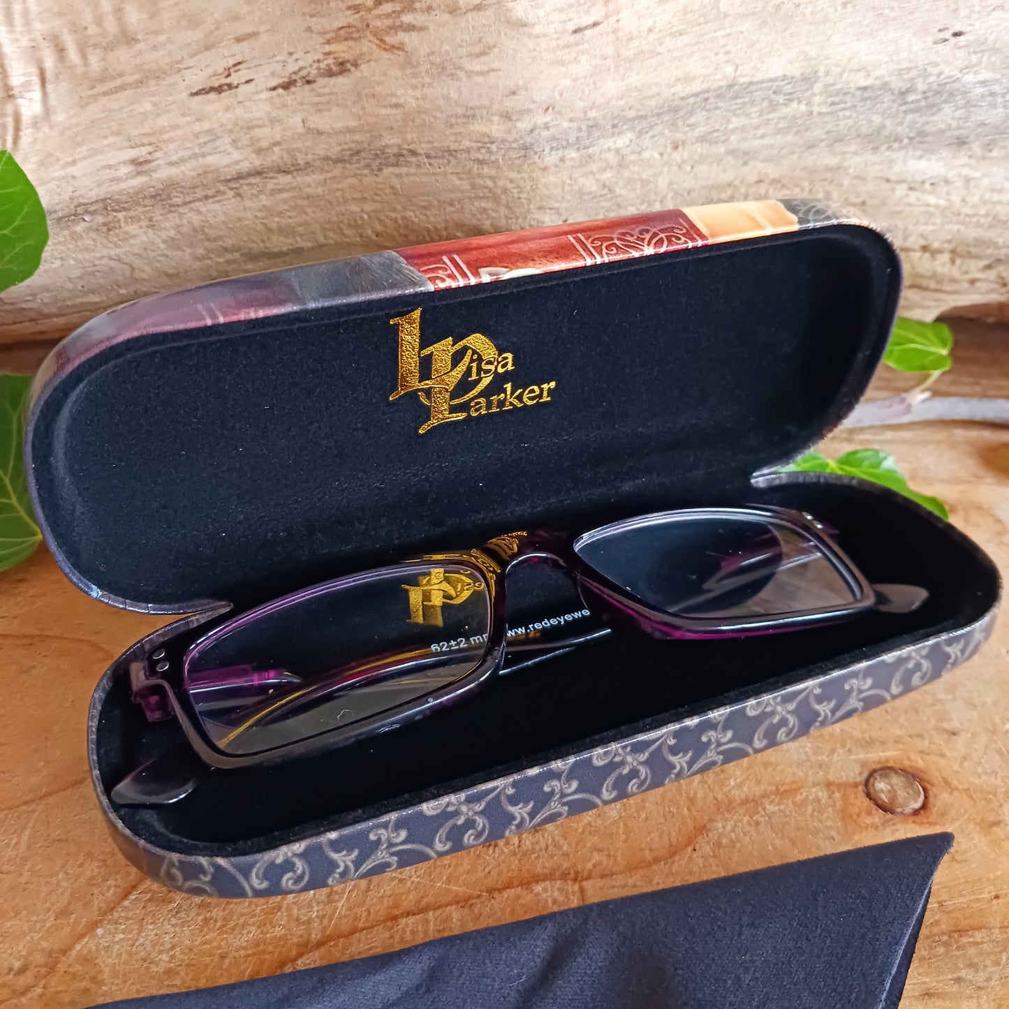 Protect your eyewear in spellbinding style with the Witching Hour Glasses Case by renowned fantasy artist Lisa Parker. Featuring the captivating Witching Hour artwork, this enchanting case is brought to life with vibrant, high-quality printing that truly stands out.