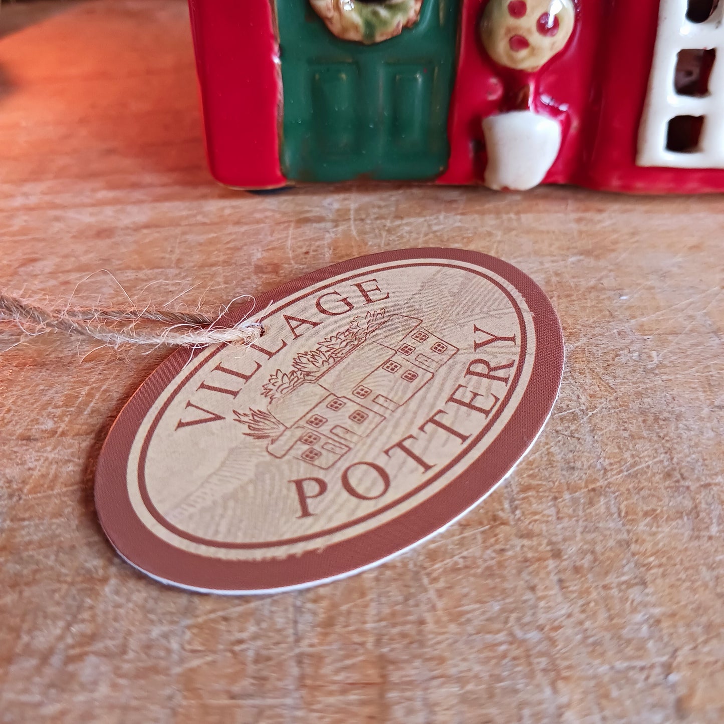 Bring nostalgic festive charm to your home with our Christmas Toy Shop Ceramic Tealight Holder, handcrafted in the Village Pottery workshop. This detailed tealight house captures the magic of an old-world toy shop on a snowy winter’s evening. 