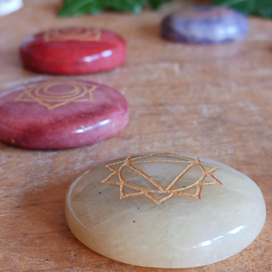 Bring balance and focus to your spiritual practice with this Seven Chakra Crystal Stone Set. Featuring seven natural crystal discs, each engraved with the symbol of a different chakra, this set is ideal for meditation, crystal therapy, yoga and other spiritual practices.