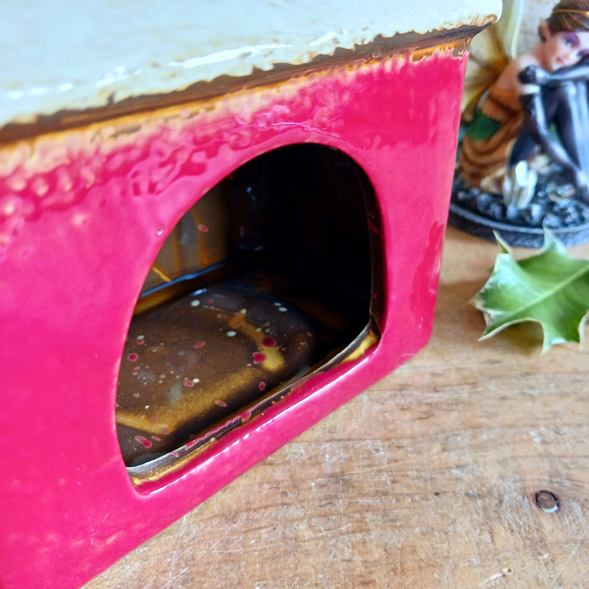 Bring a touch of festive village charm to your home with the Village Pottery Xmas Rudolph’s Stable Tealight Holder. This delightful ceramic Christmas decoration is designed as a quaint little stable, featuring a snowy roof, traditional green doors and charming reindeer detailing.