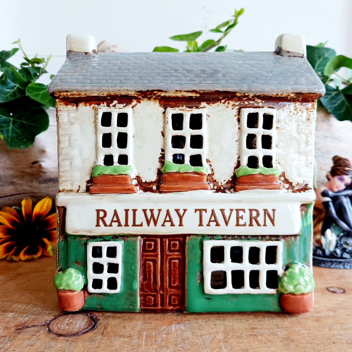 Bring a little British village charm into your home with this delightful Village Tavern Tealight Holder, beautifully hand-crafted in ceramic and hand-painted with charming, characterful details.