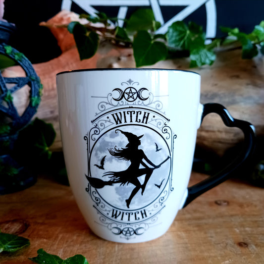 When the moon rises and the stars awaken, the Midnight Witch takes flight. Glide through twilight skies with this enchanting Witch Mug by Alchemy, a perfect blend of gothic charm and whimsical magic.