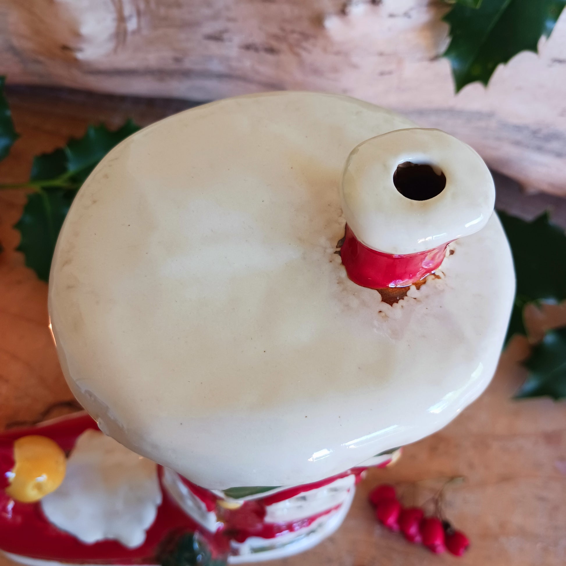 Step into the world of festive enchantment with the Village Pottery Christmas Elf Boot House Tealight Holder, a playful handcrafted ceramic creation bursting with Christmas spirit. Measuring 16 x 16 x 9.5 cm, this delightful piece takes the shape of a cheerful elf’s boot turned into a cosy little house, complete with twinkling windows and snowy details.