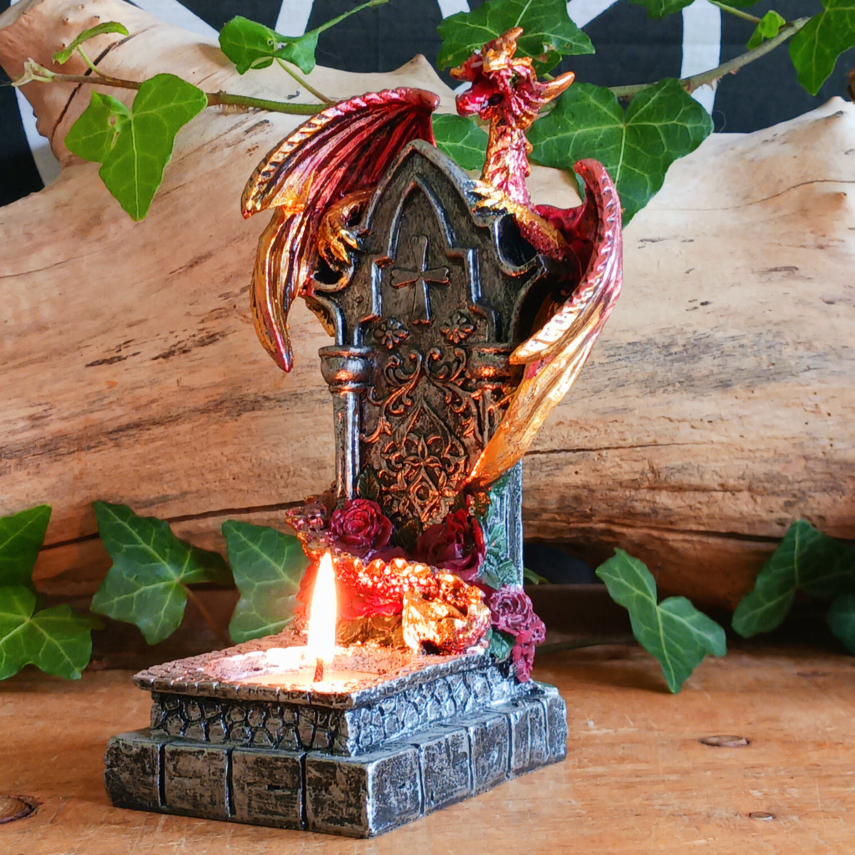 Bring a touch of mythical magic to your home with the Light of the Dragon Red Ornamental Tealight Holder. Featuring an enchanting red dragon coiled around a tombstone-style base, this intricately detailed candle holder is perfect for fantasy lovers and collectors of unusual home décor.
